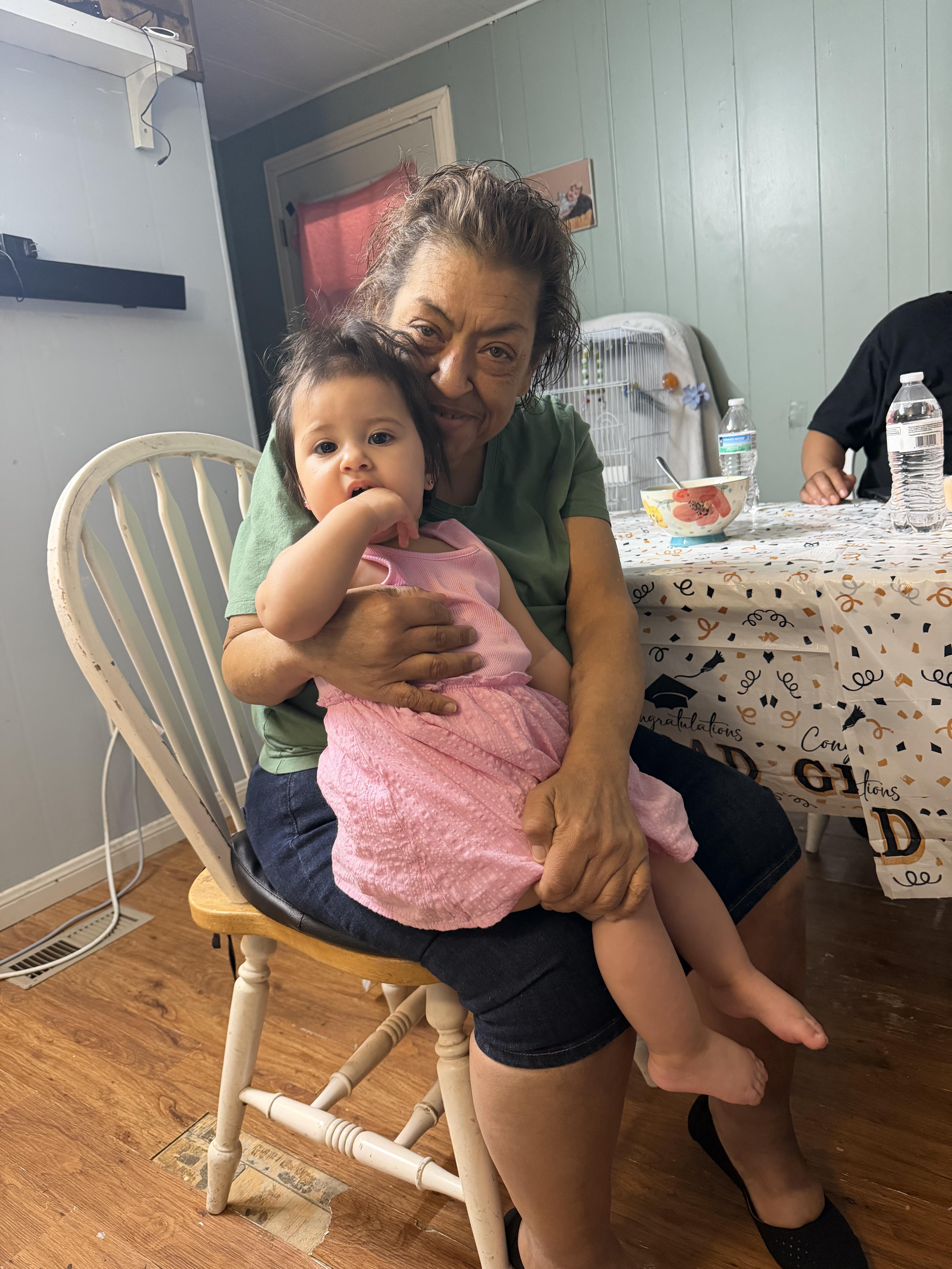 A woman holding a baby