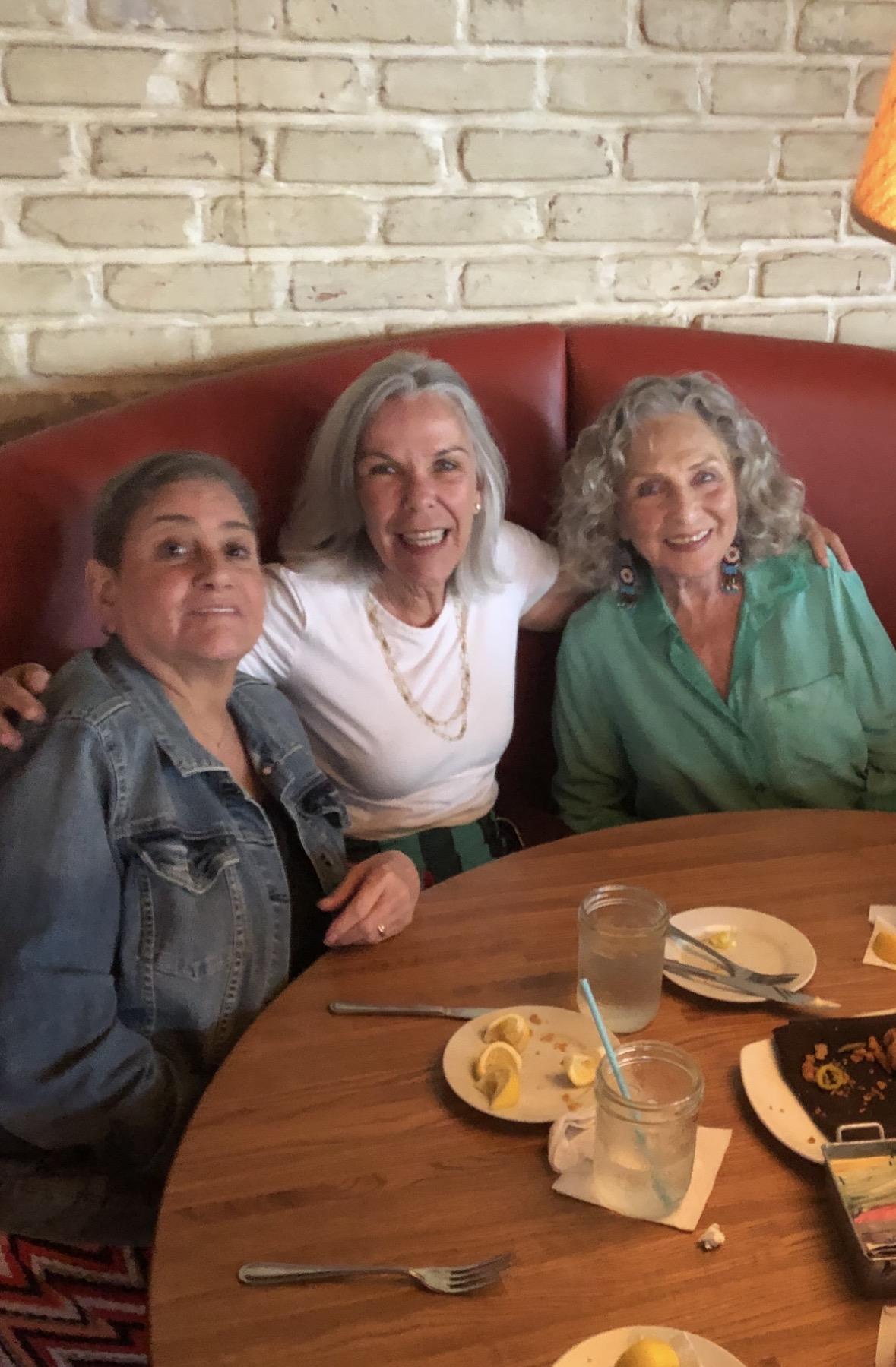 A group of women sitting at a table