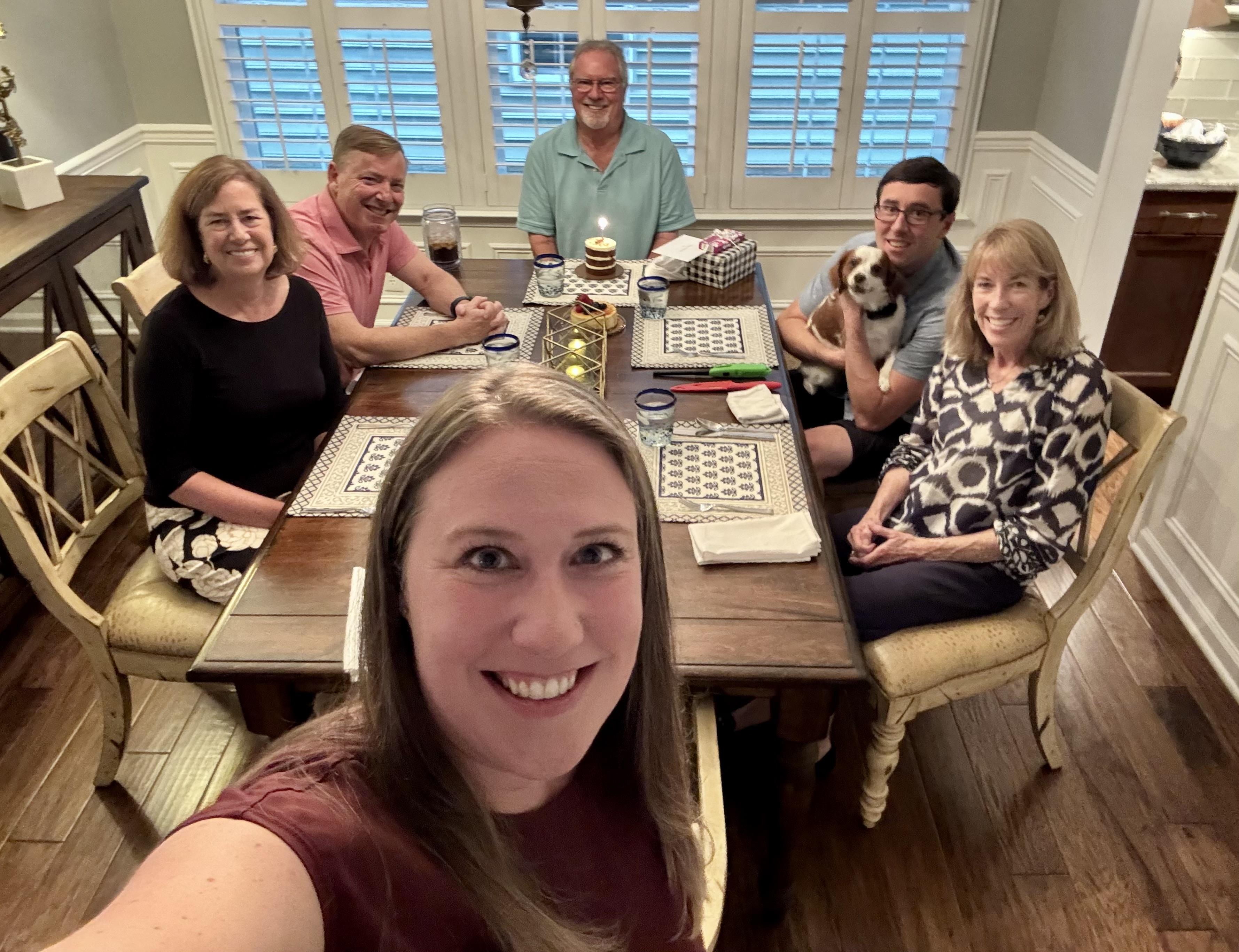 A group of people sitting around a table