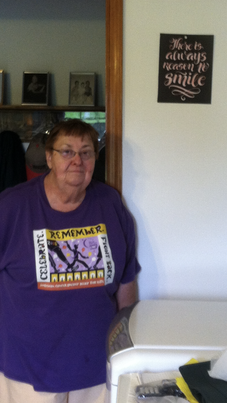 A woman in a purple shirt
