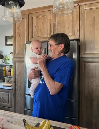 A man holding a baby