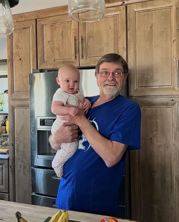 A man holding a baby