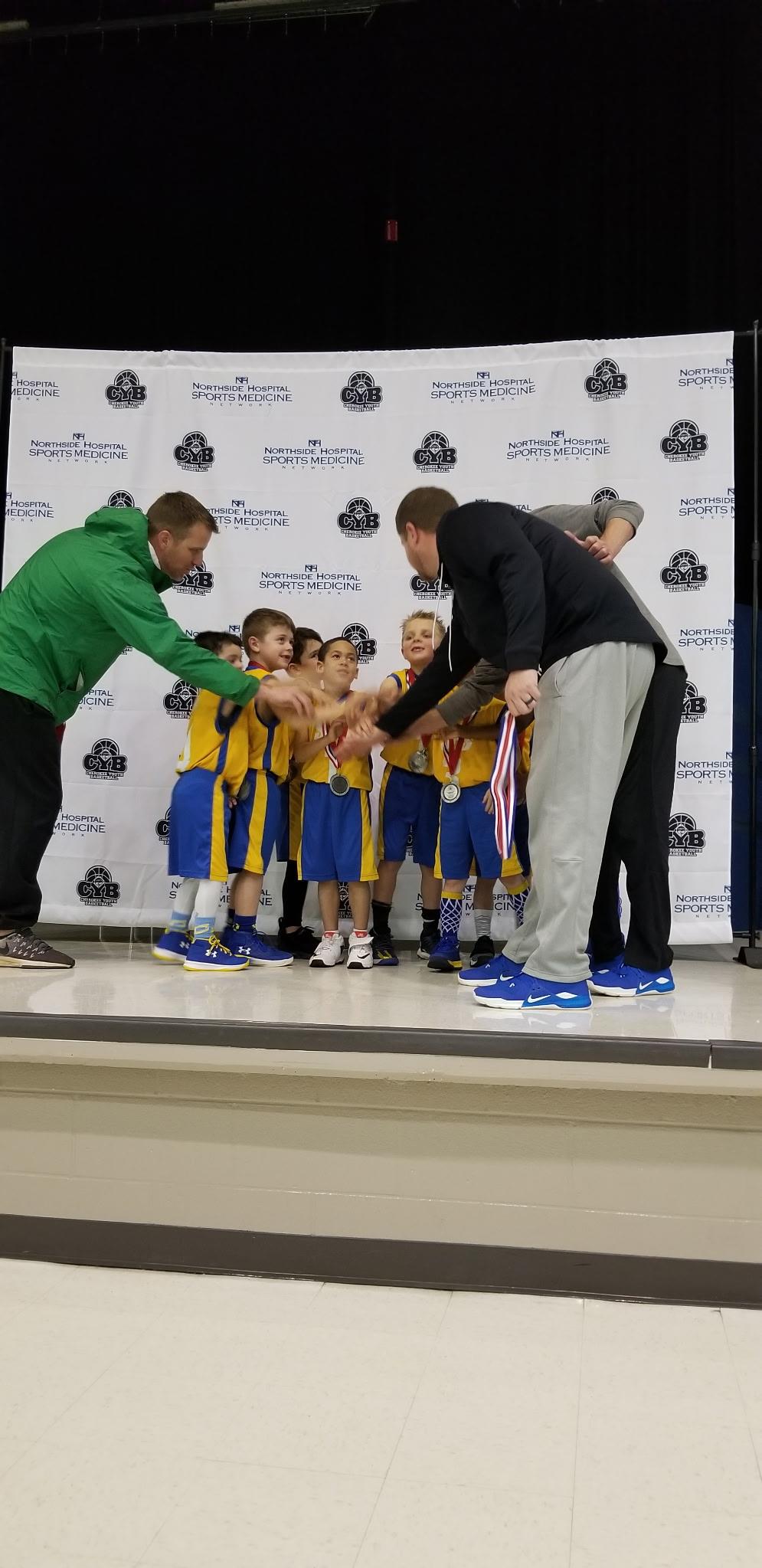 A group of kids wearing medals
