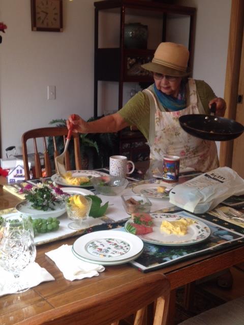 A woman cooking at a table