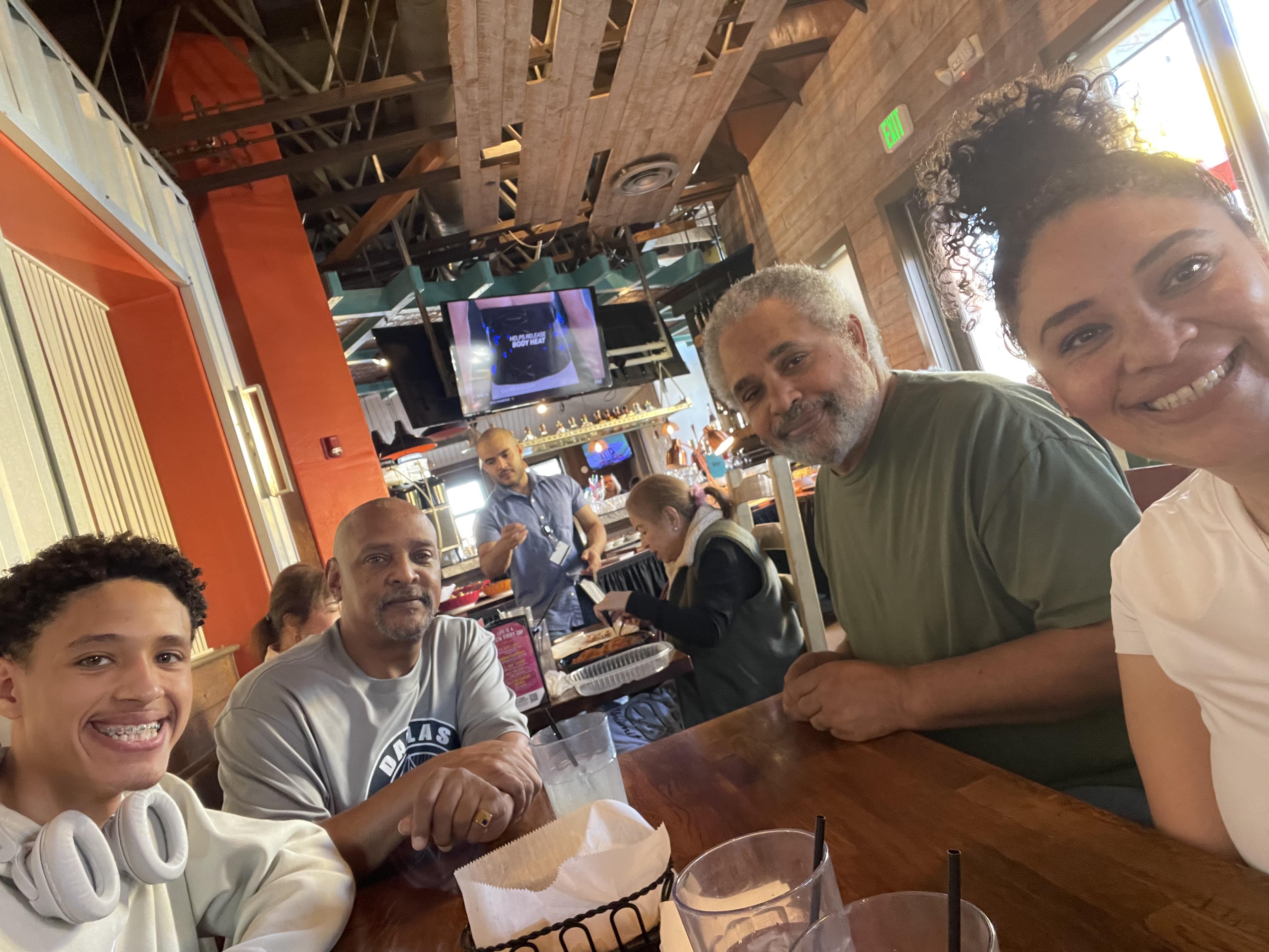 A group of people sitting at a table