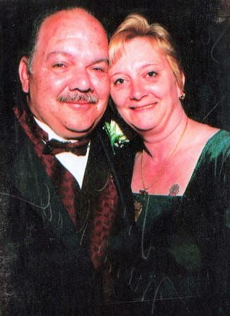 A man and woman smiling for a picture