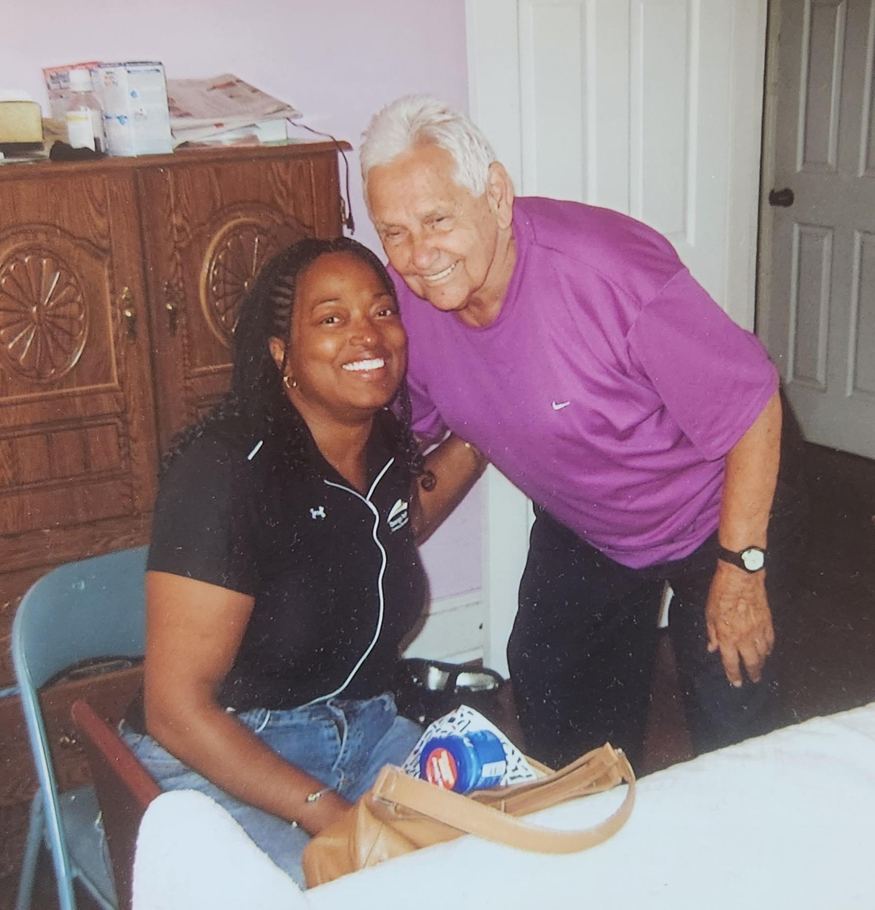 A man and woman smiling