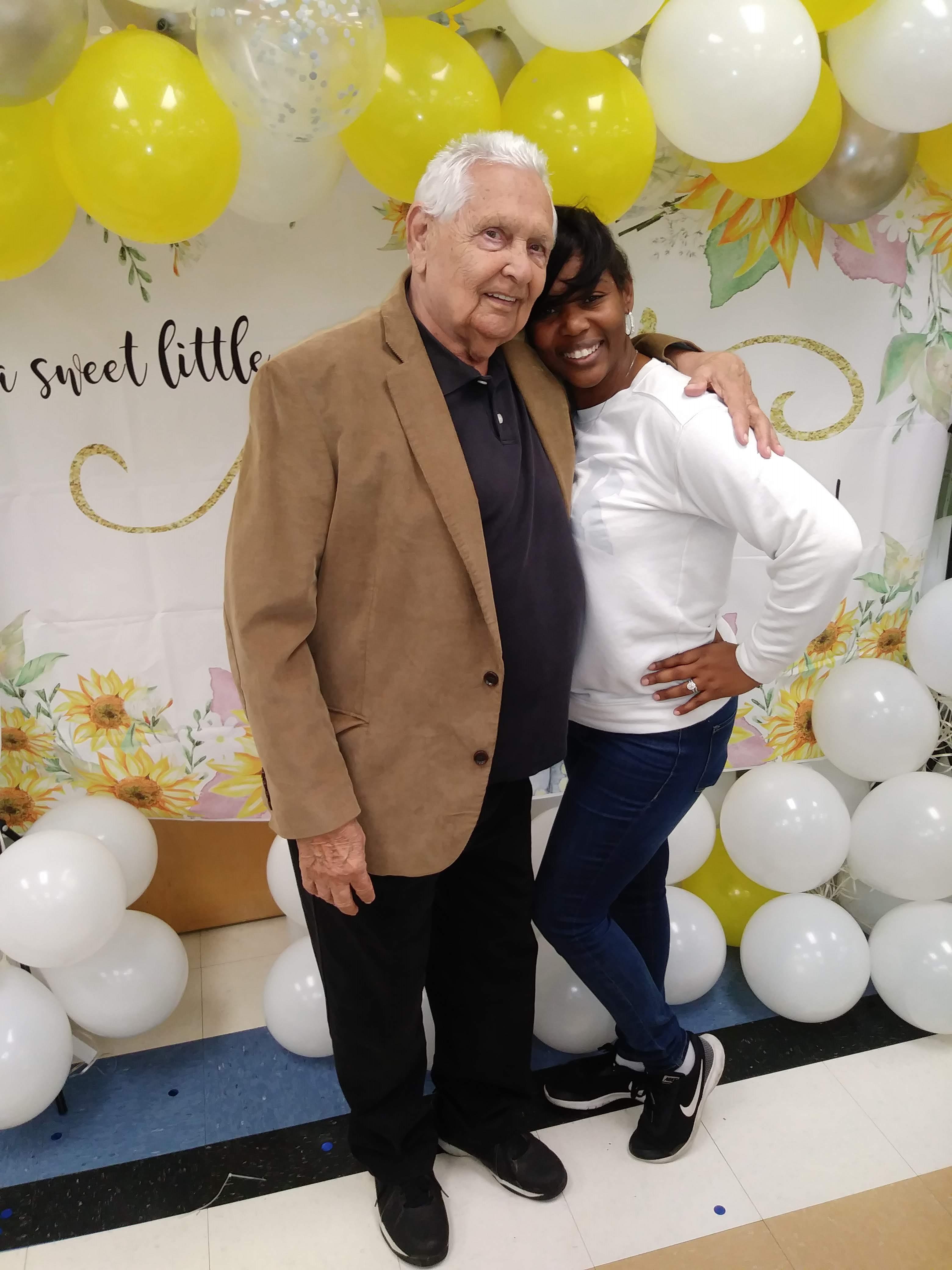 A man and woman posing for a picture