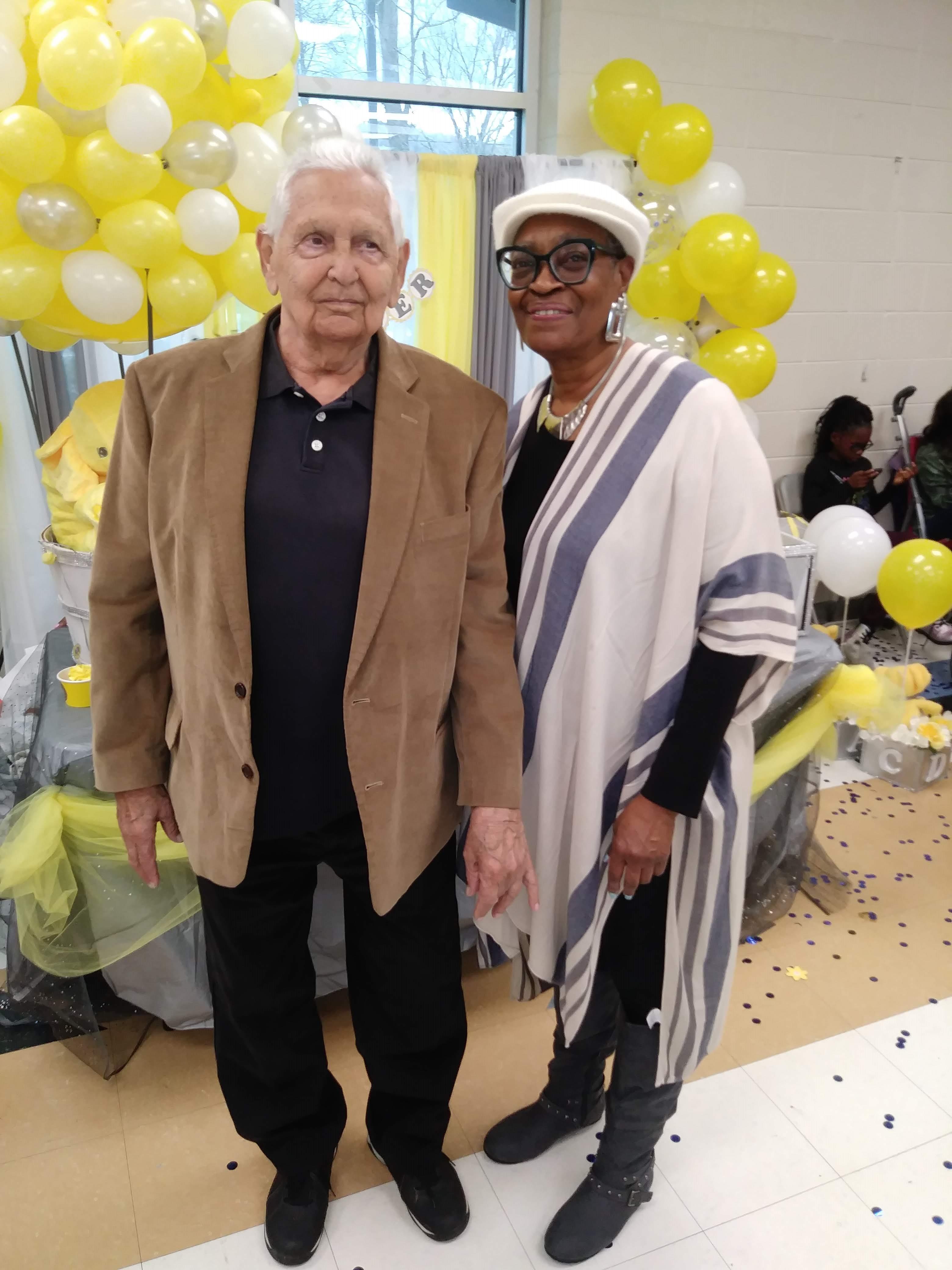A man and woman standing next to each other