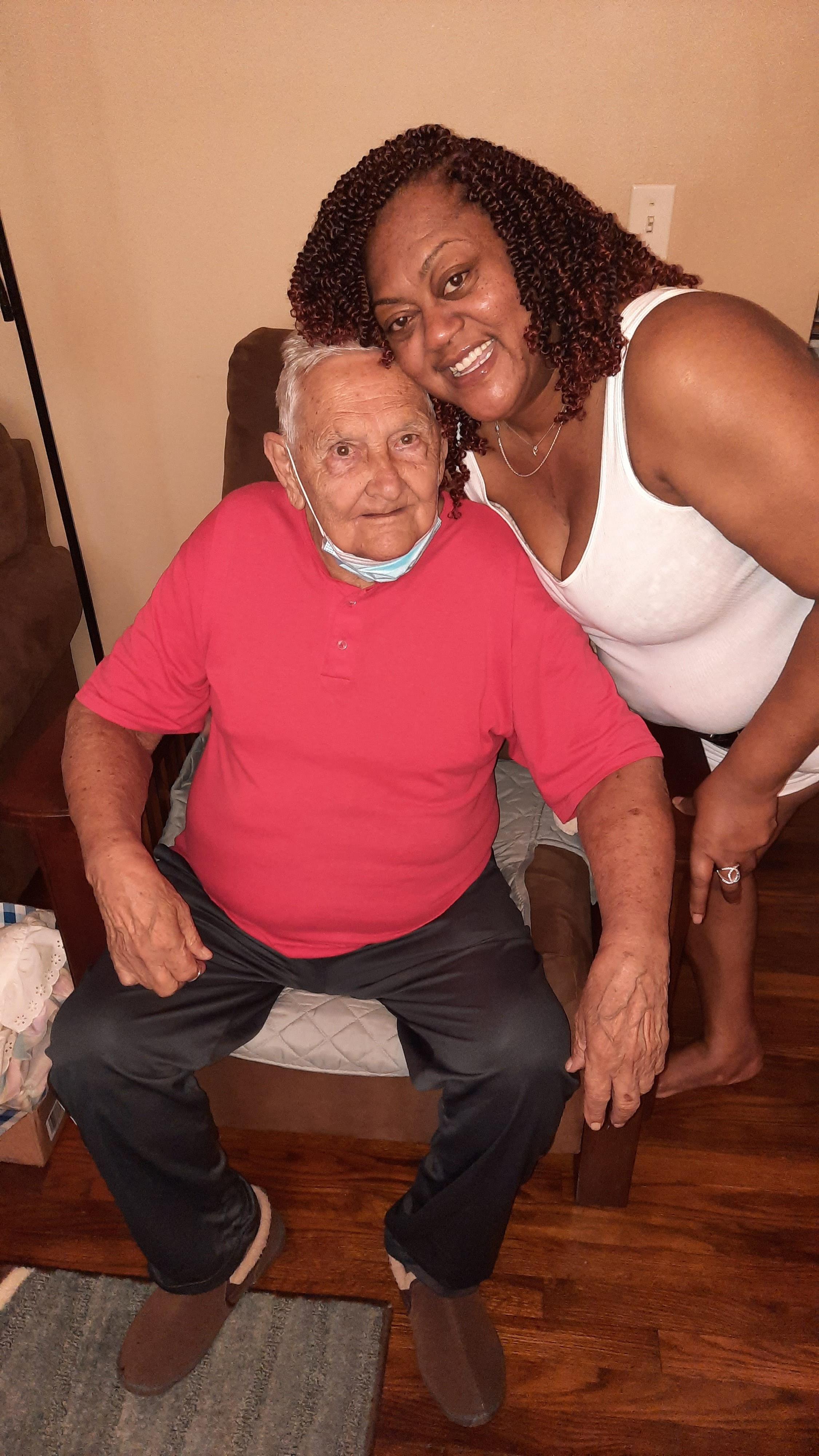 A woman and man sitting on a chair