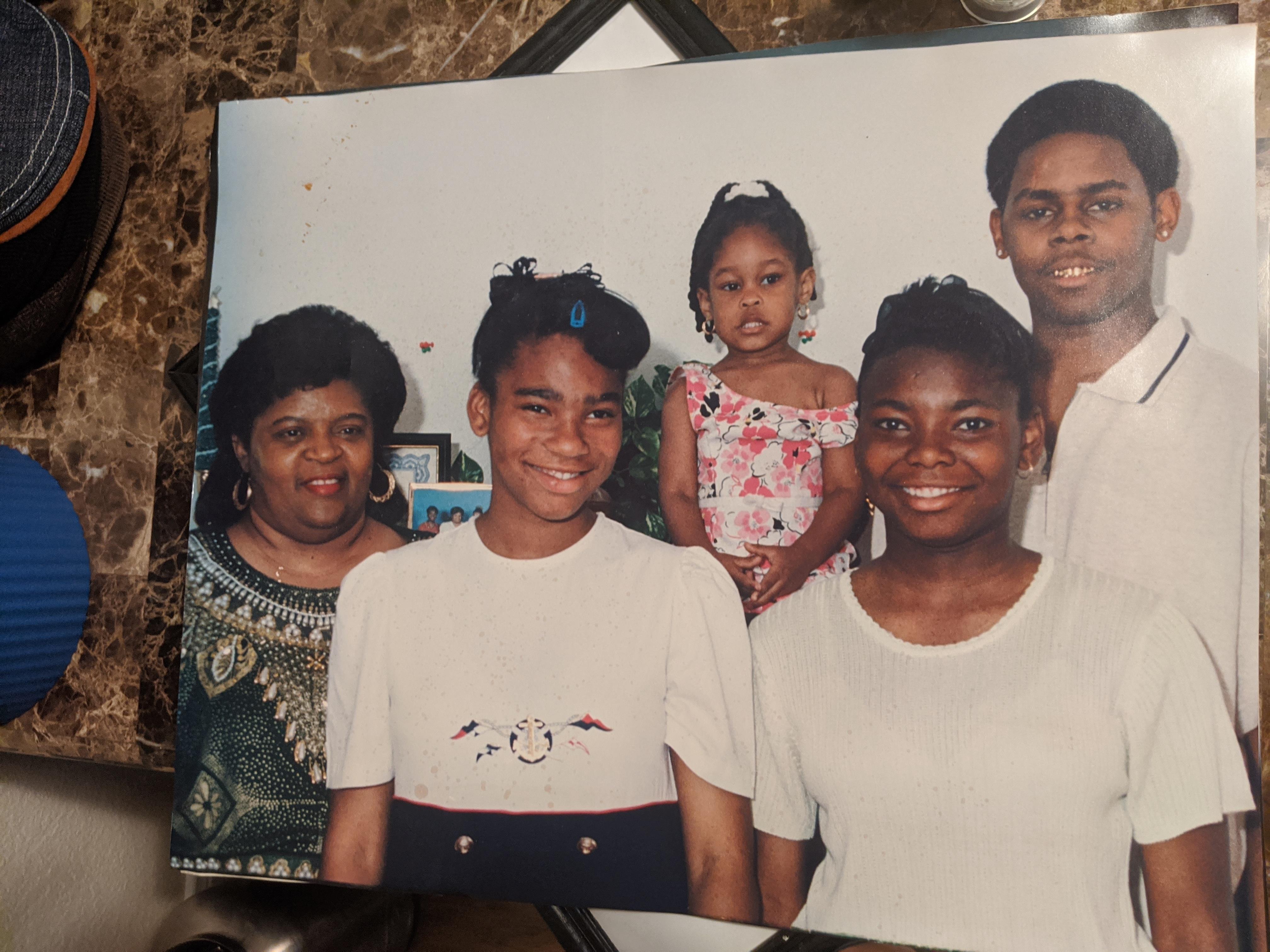 A family photo of a man and a woman and a child