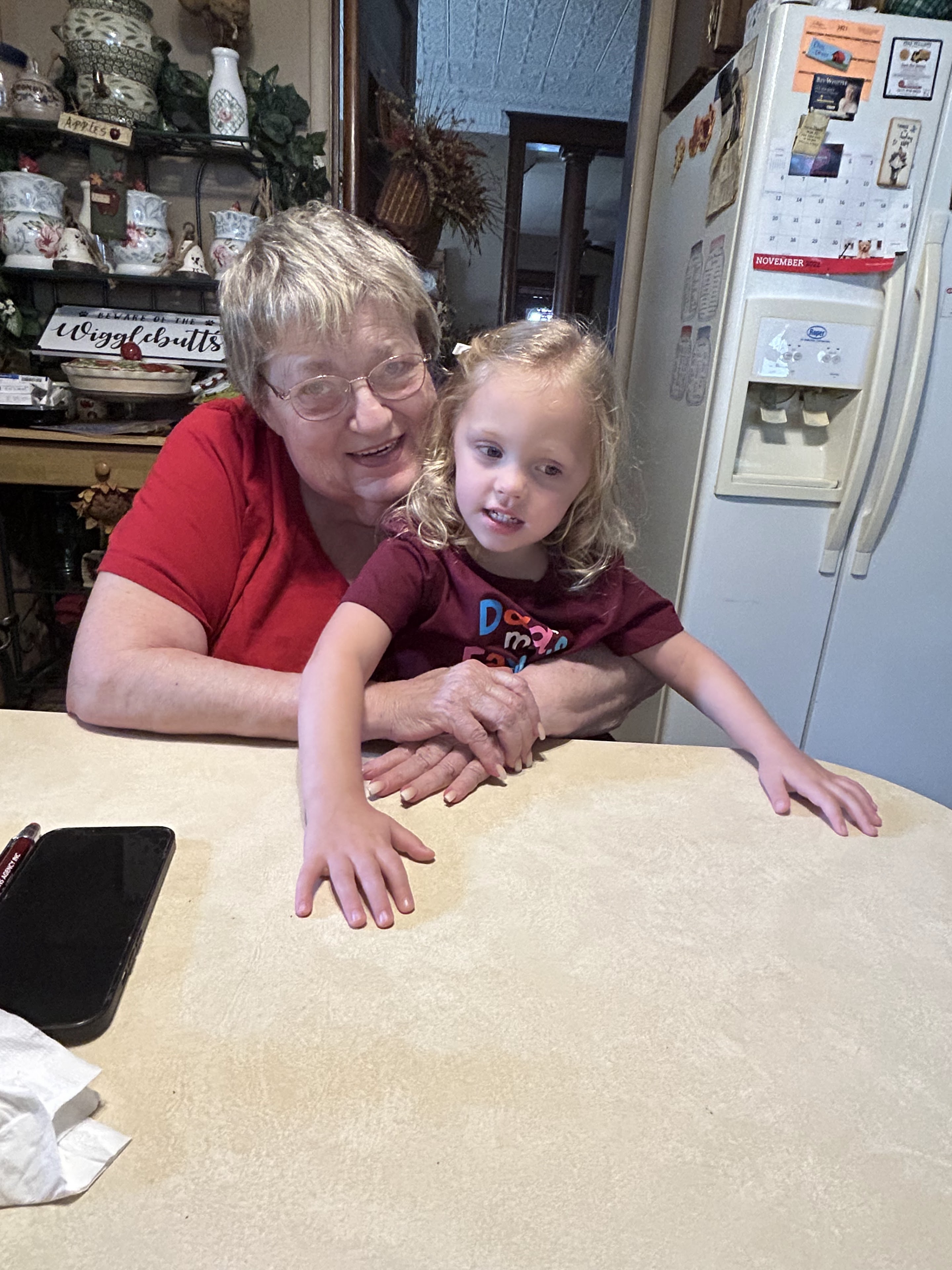 A woman and a child sitting at a table