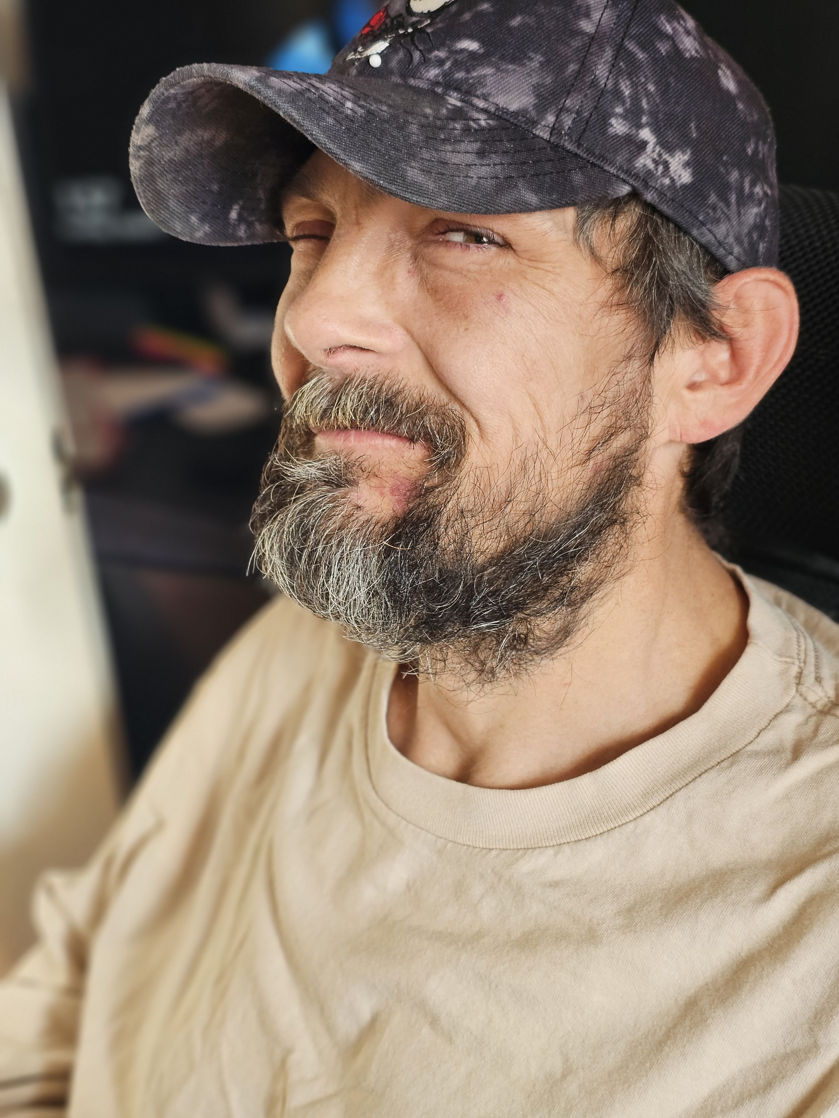 A man with a beard and a hat