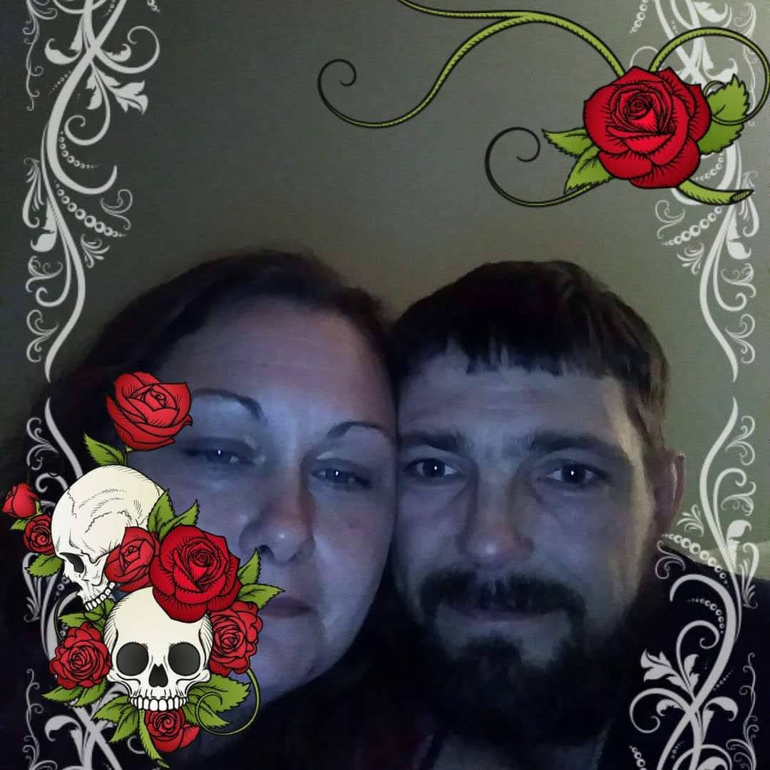 A man and woman posing for a picture