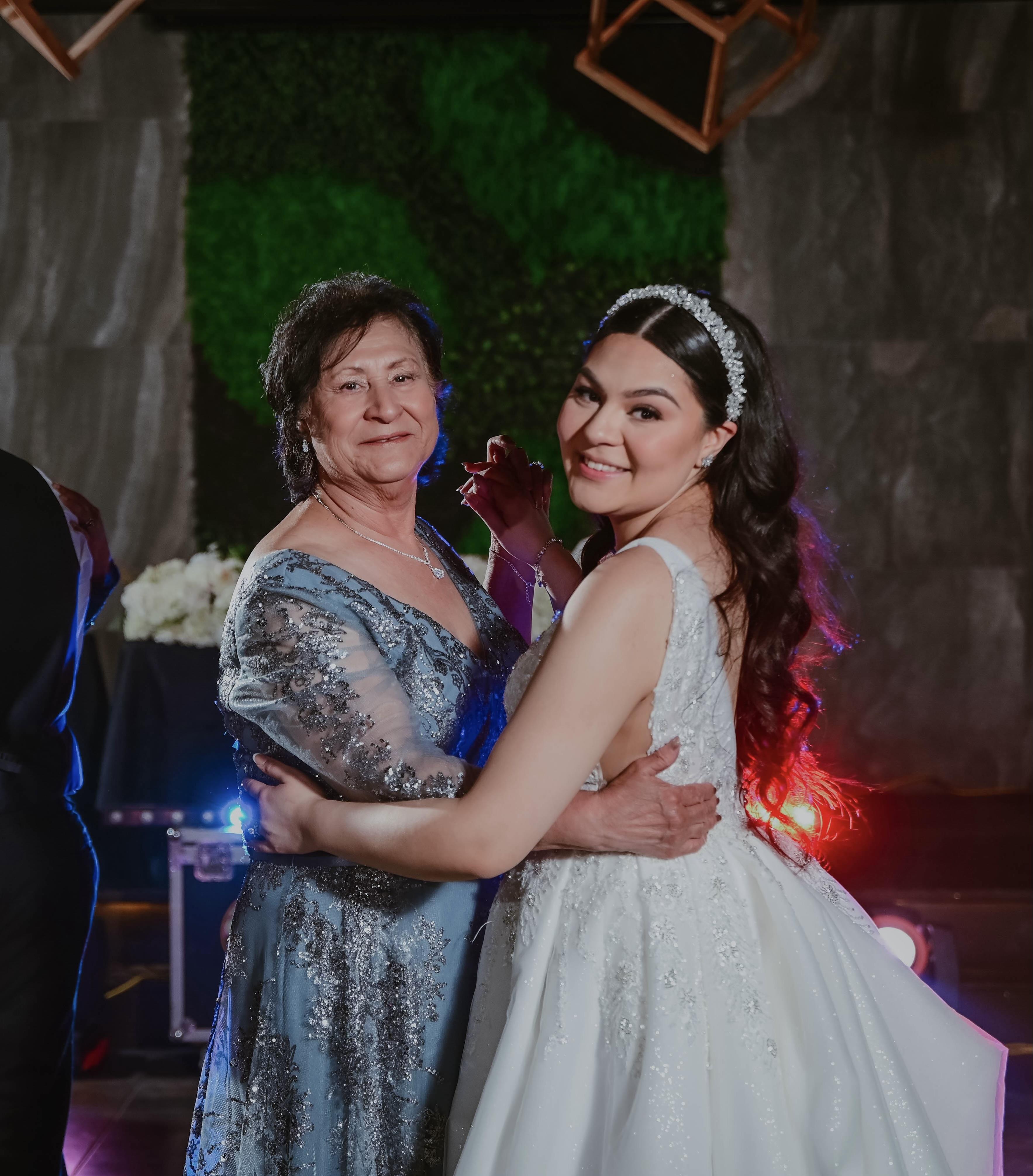 A woman hugging a woman