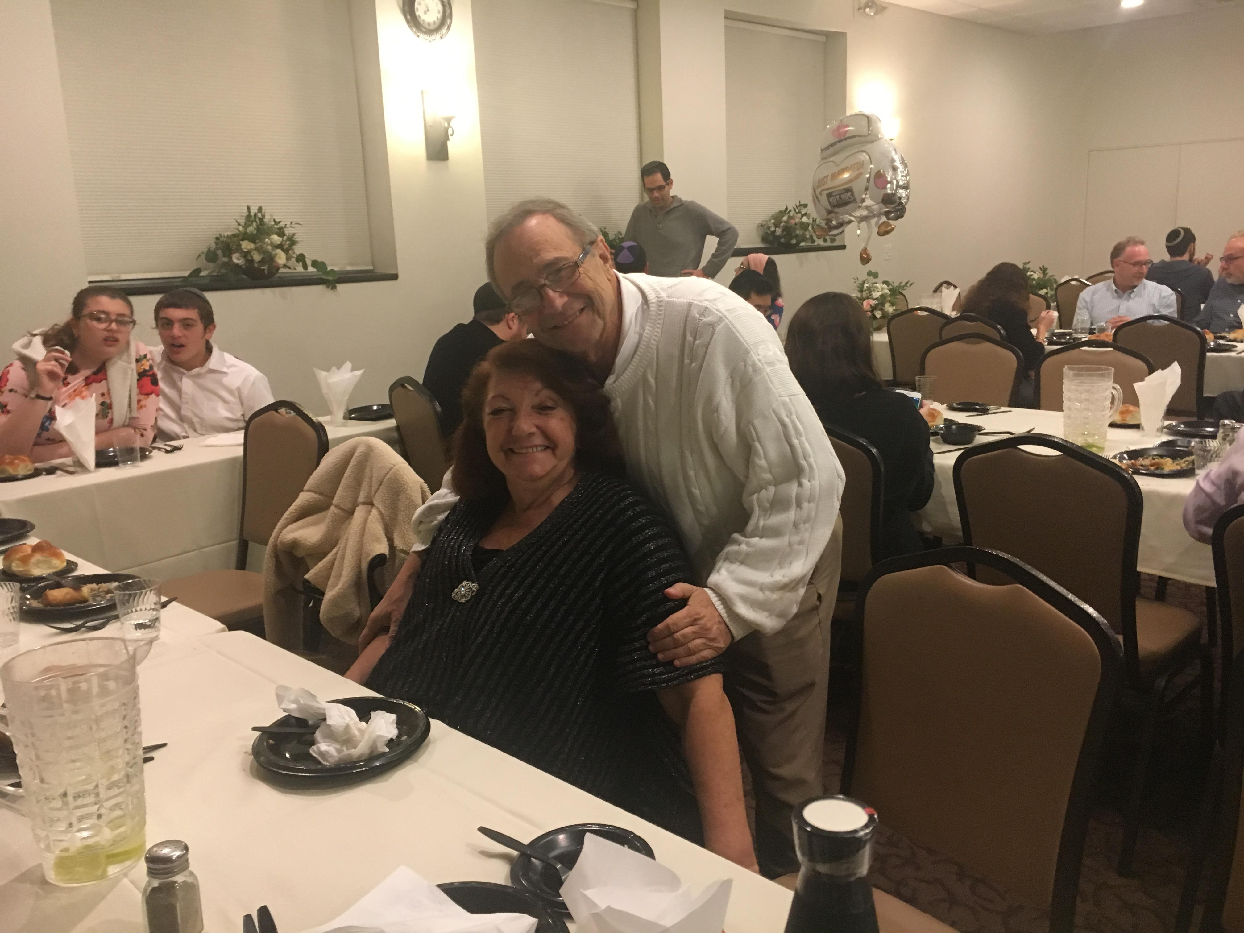 A man and woman sitting at a table