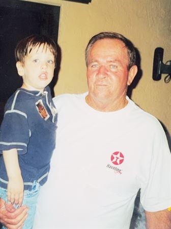 A man and boy posing for a picture