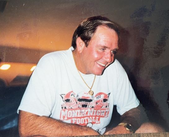A man smiling at something