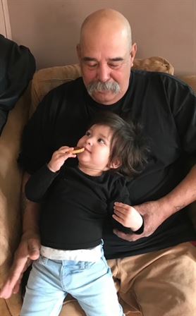 A man and child sitting on a couch