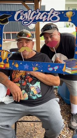 Two men posing for a picture