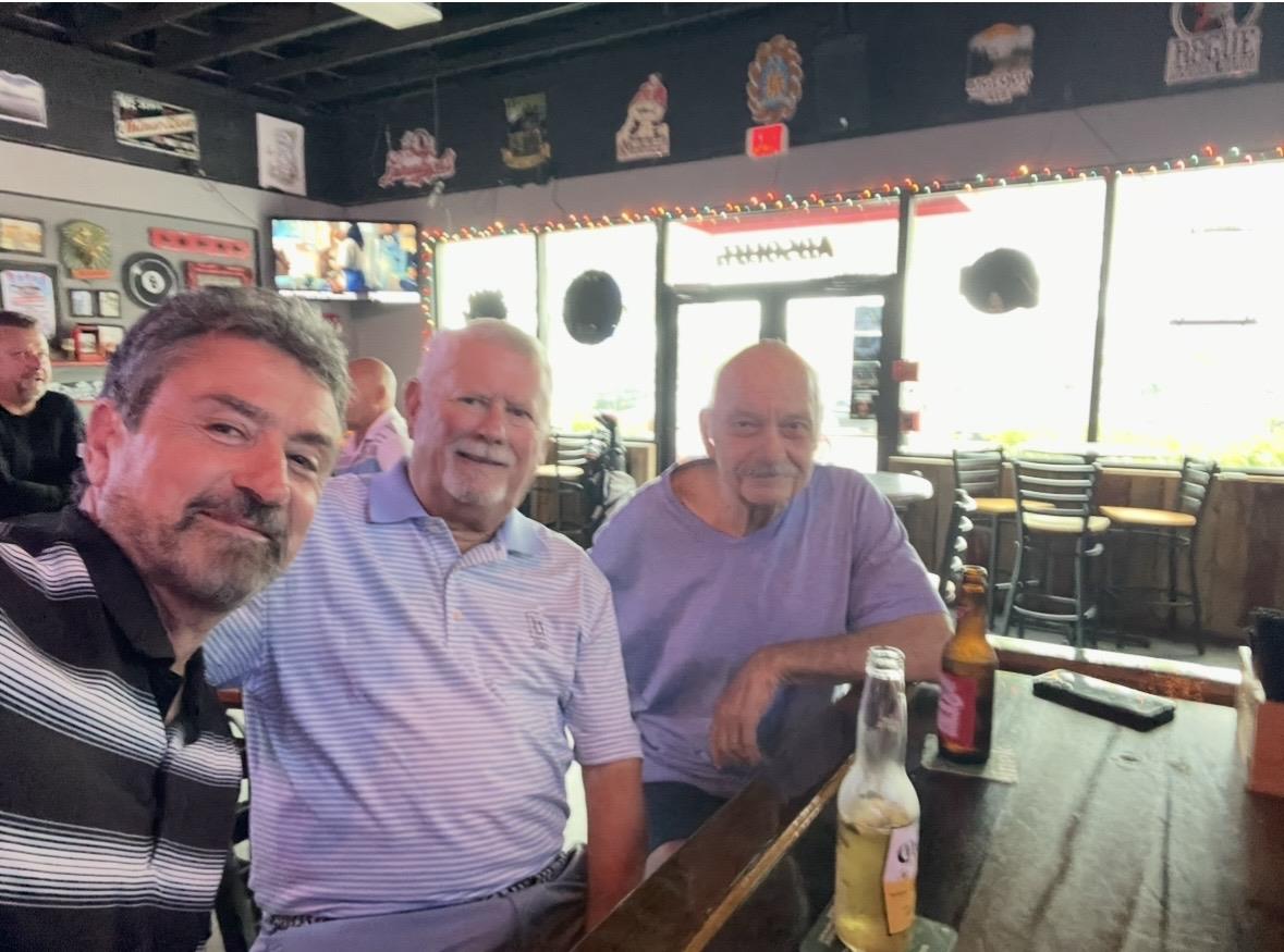 A group of men sitting at a table