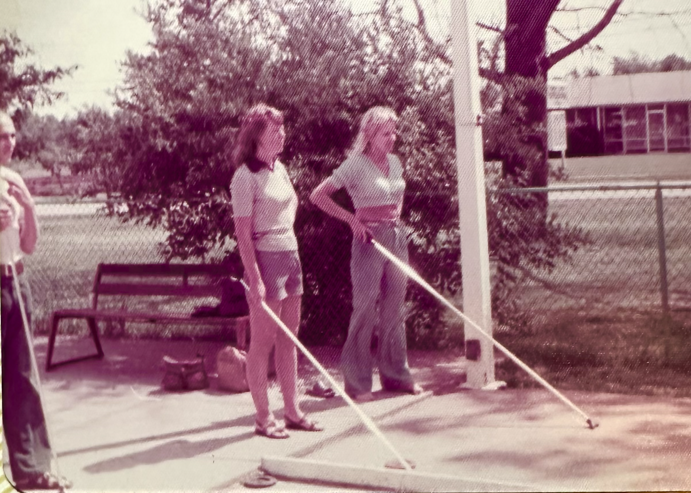 A couple of women cleaning a court