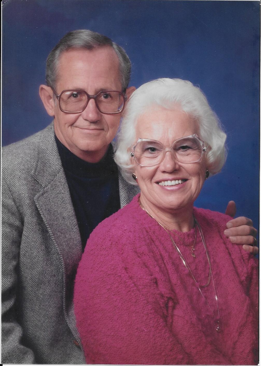 A man and woman posing for a picture