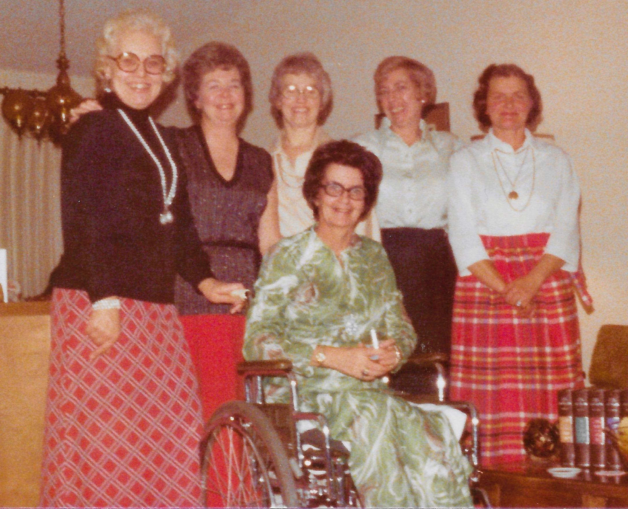 A group of women posing for a photo