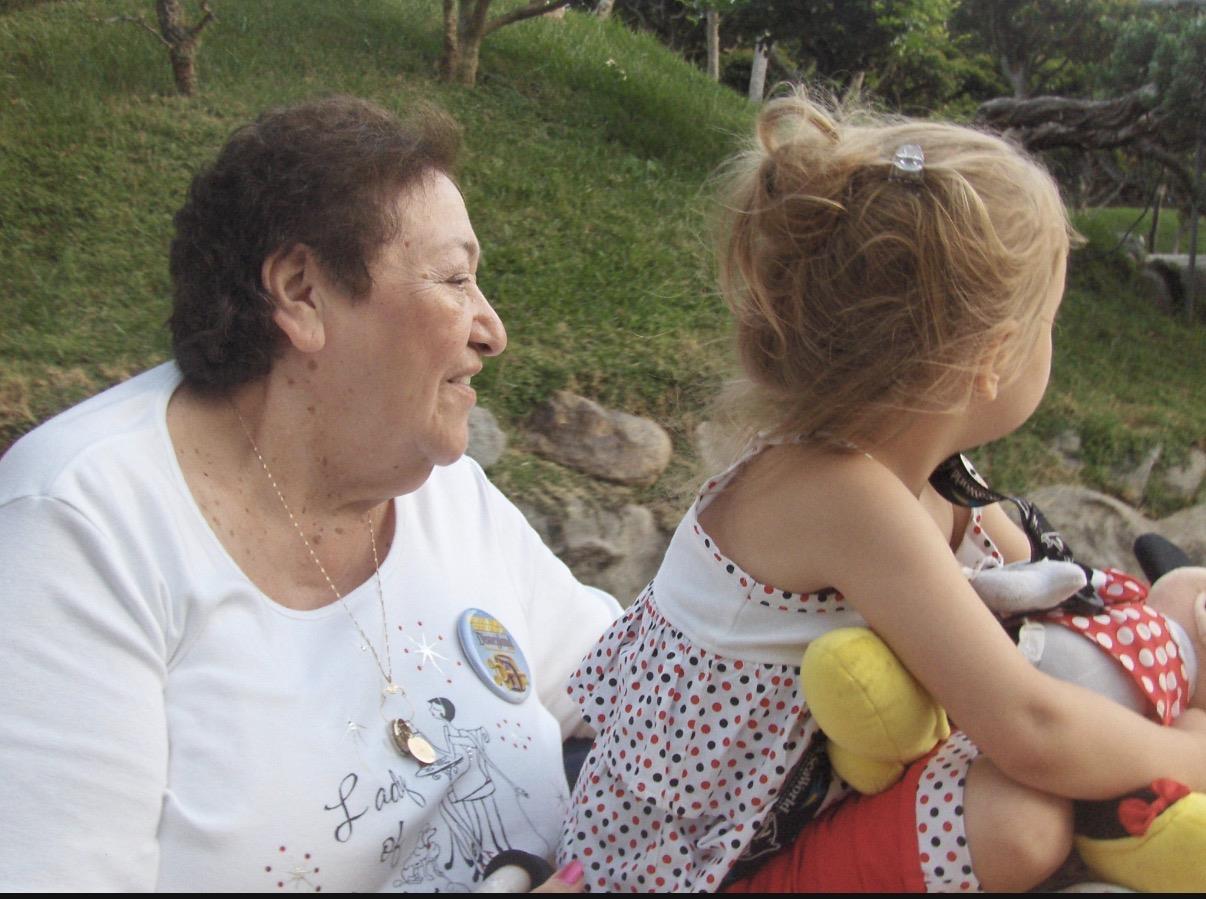 A woman holding a girl