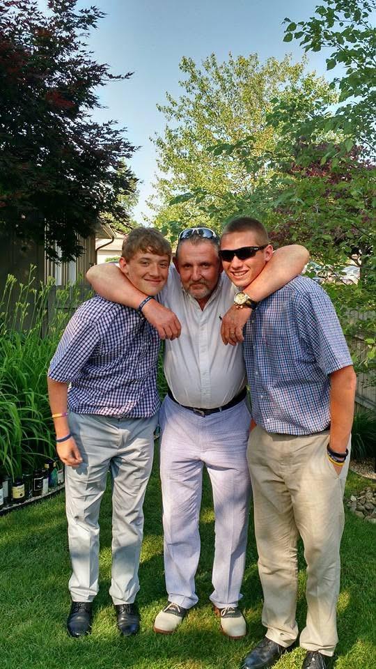 A group of men posing for a picture