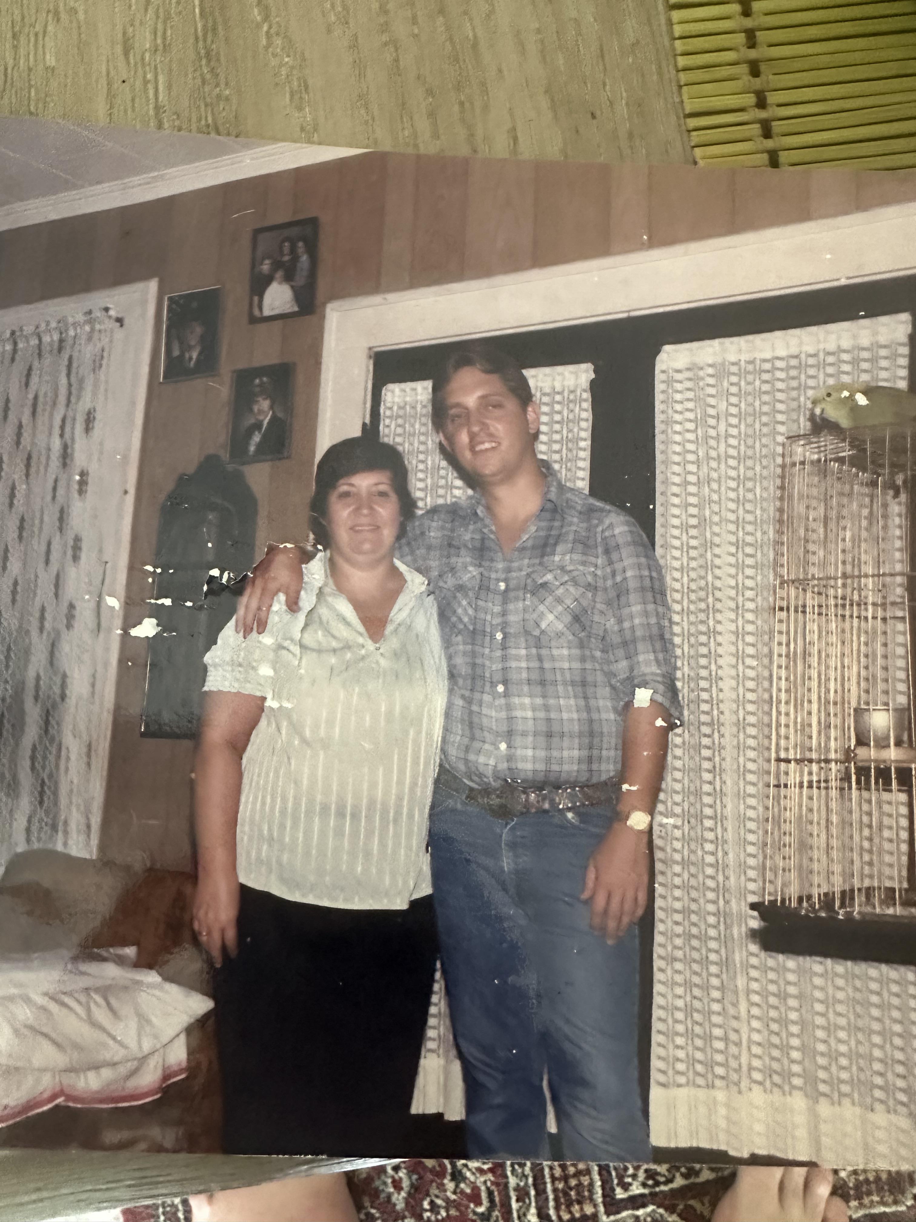 A man and woman standing in a room