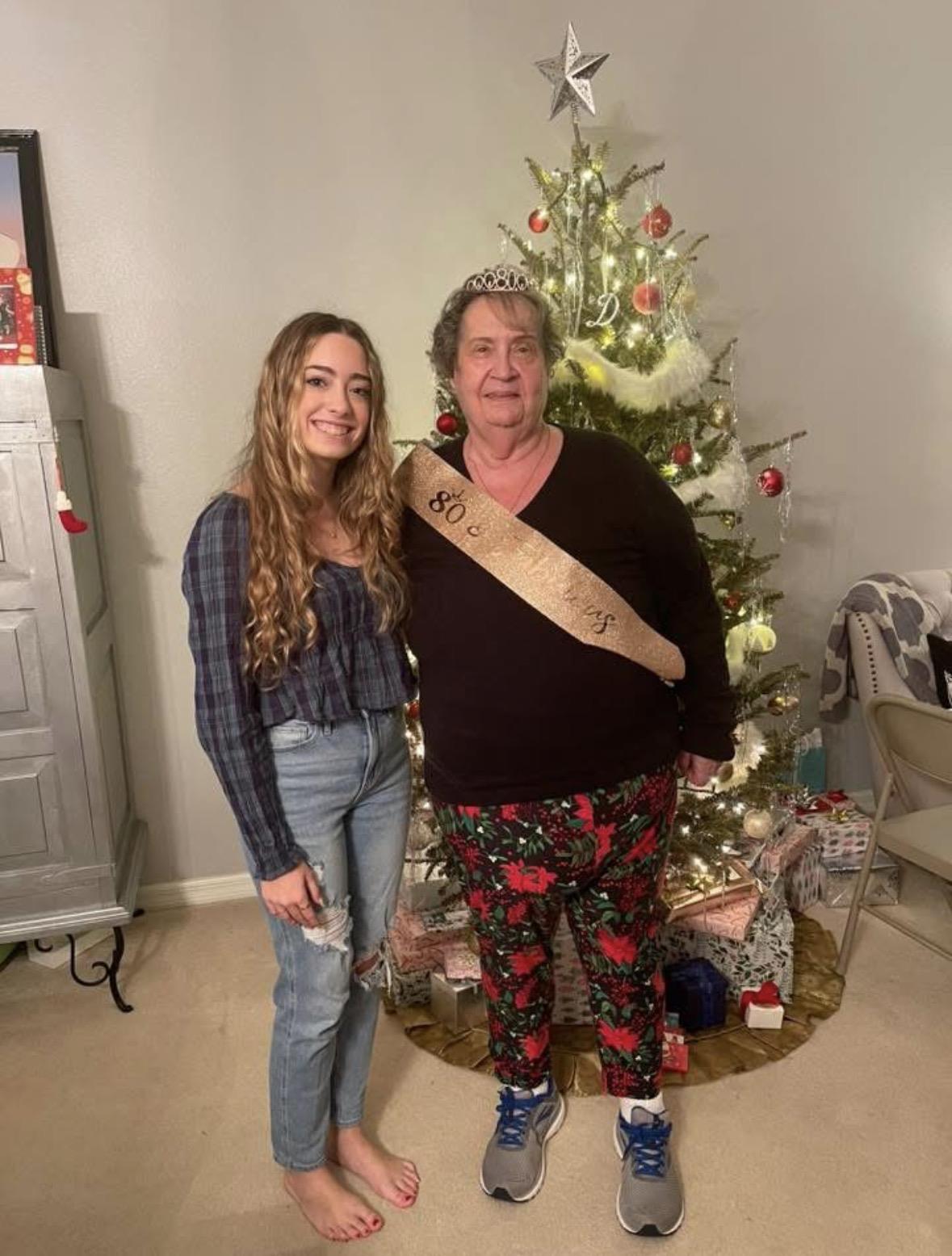 A woman and a woman posing for a picture