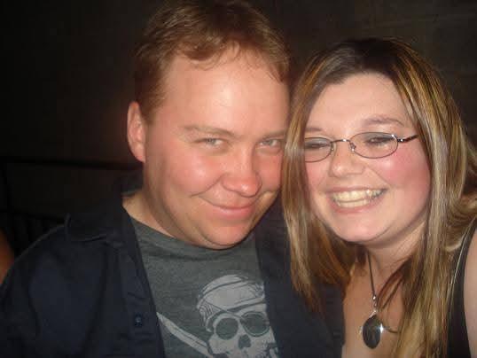 A man and woman smiling for a picture