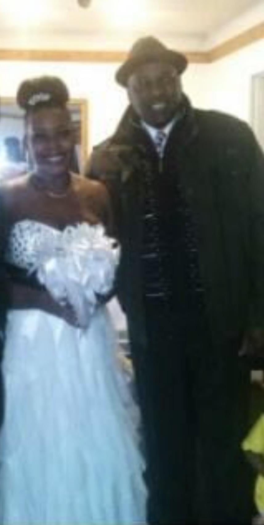 A man and woman in a wedding dress