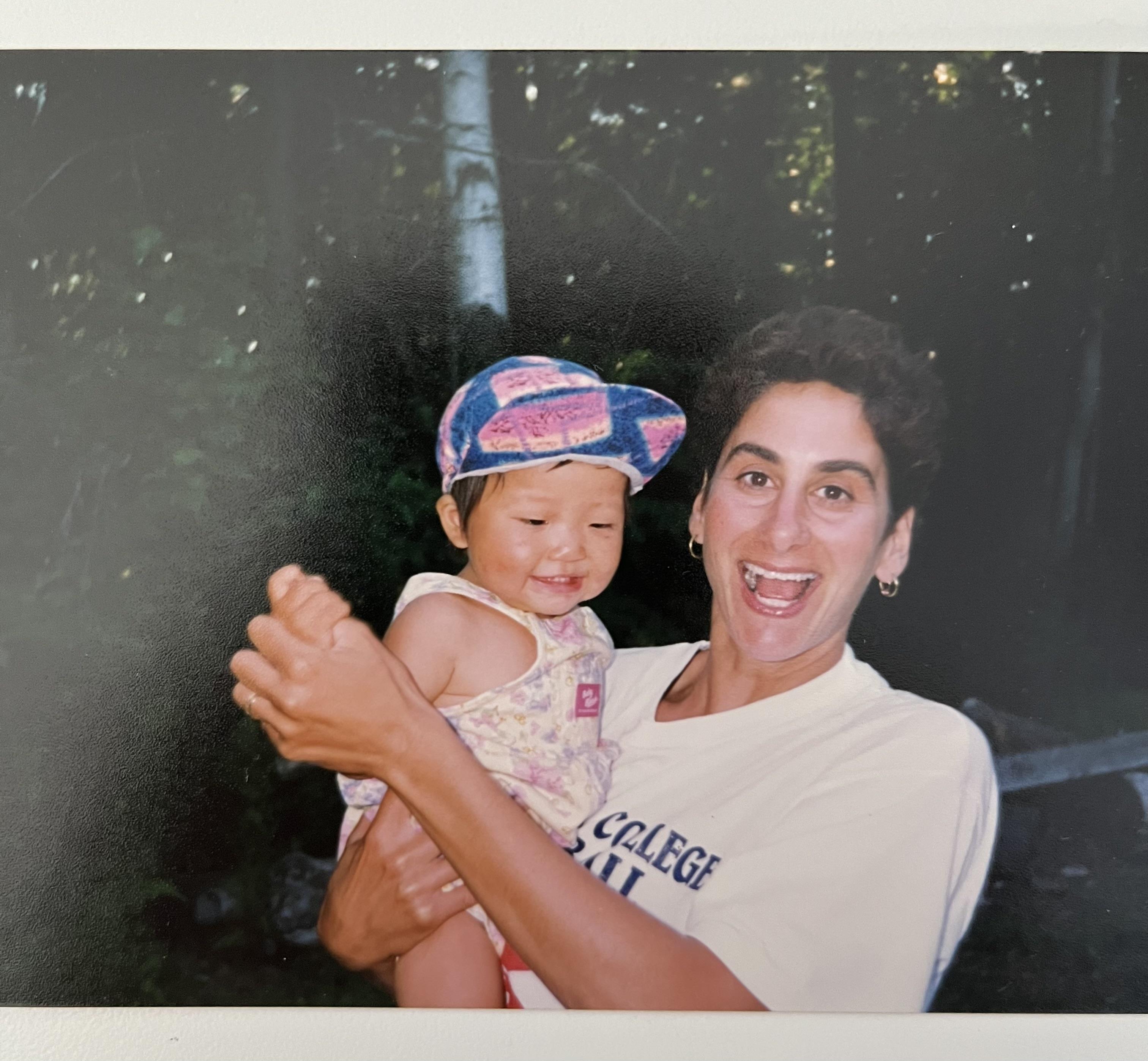 A woman holding a baby