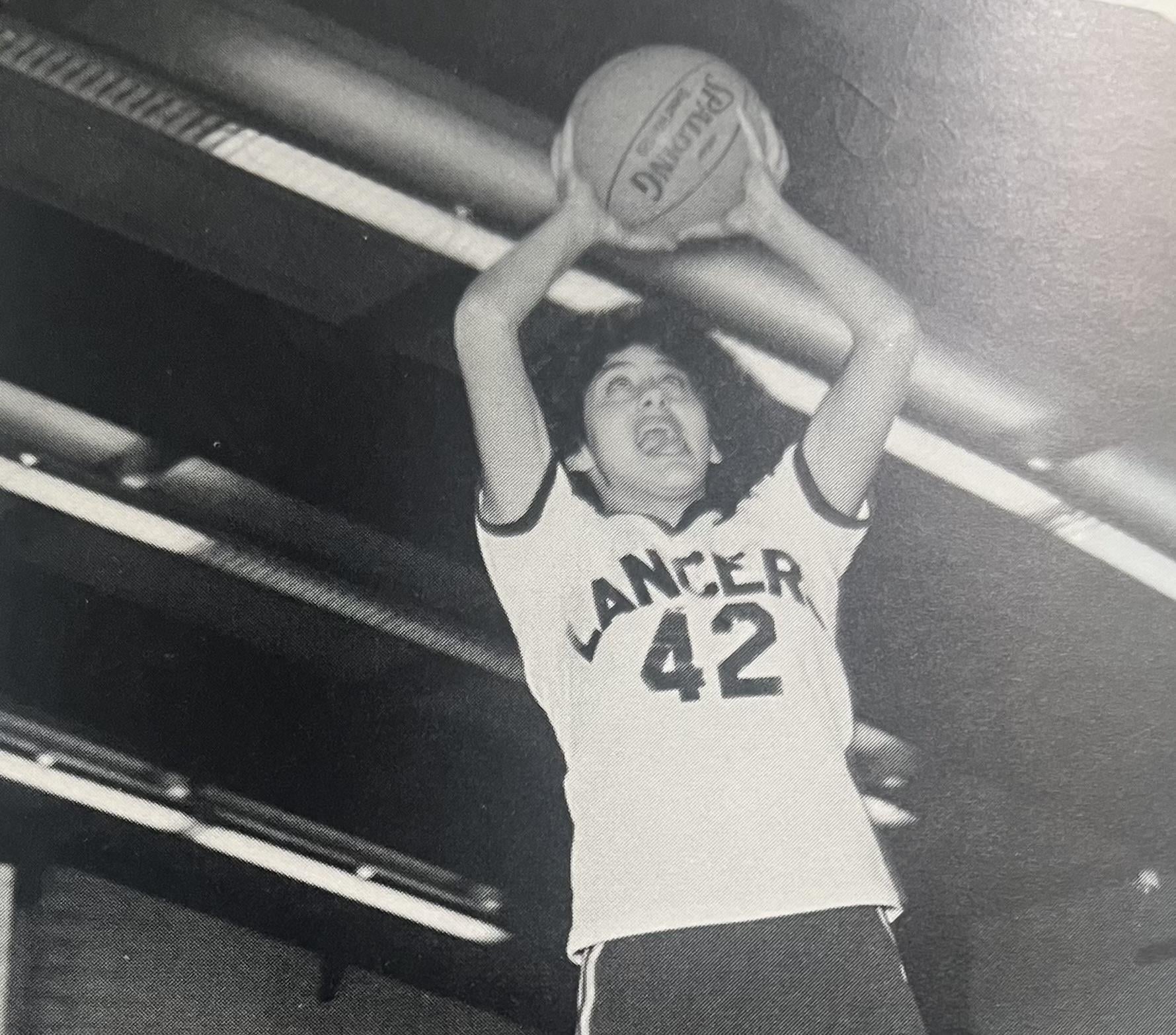 A man holding a basketball