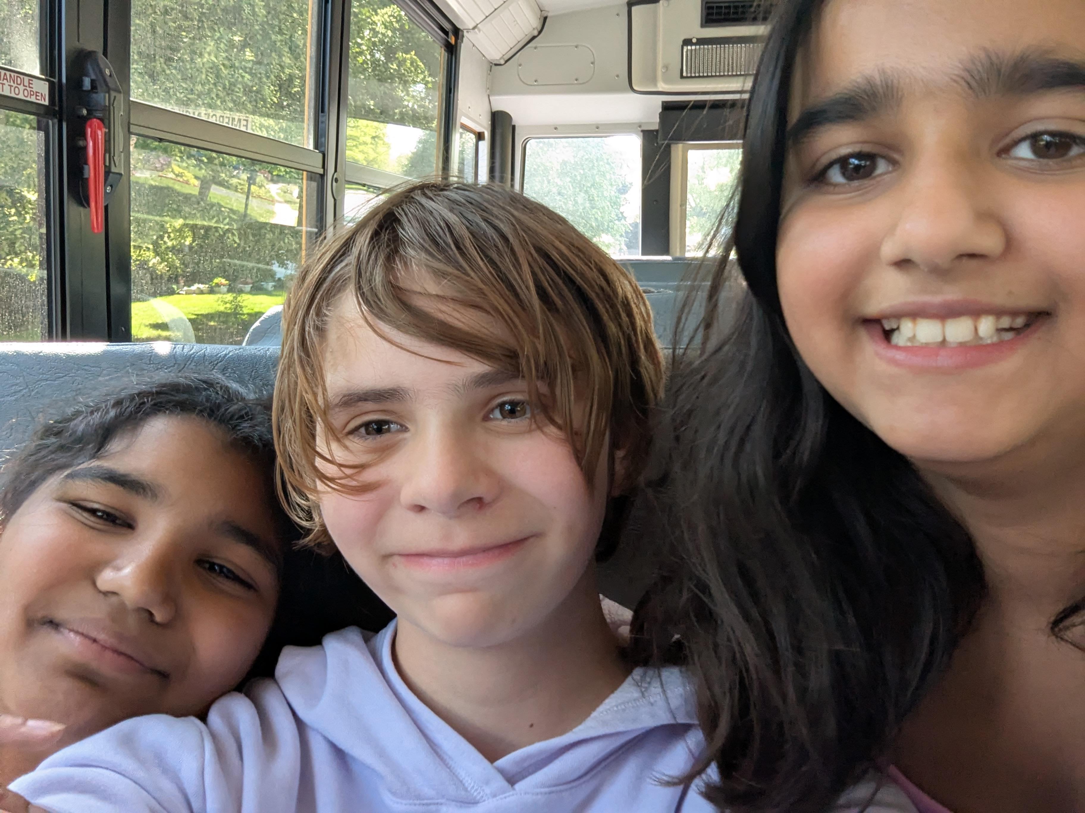 A group of kids taking a selfie