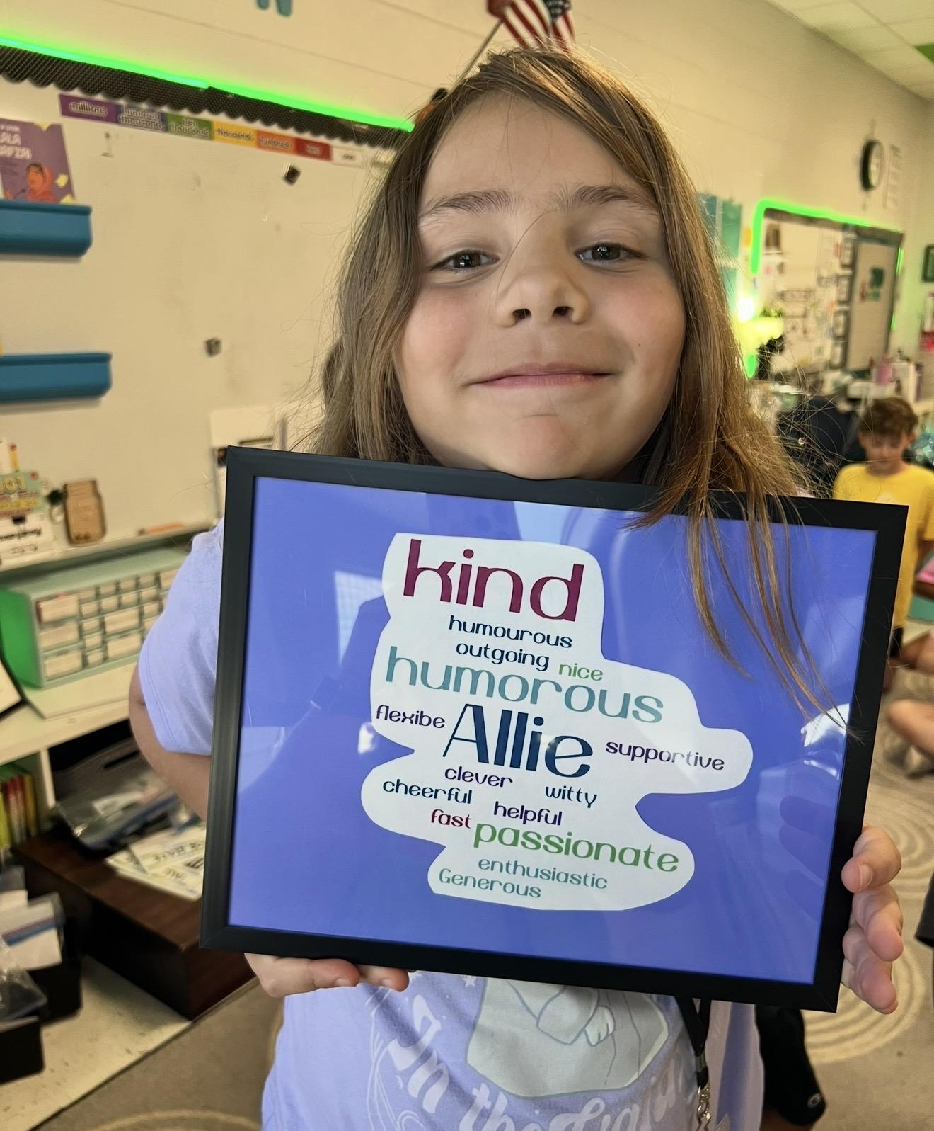 A girl holding a sign
