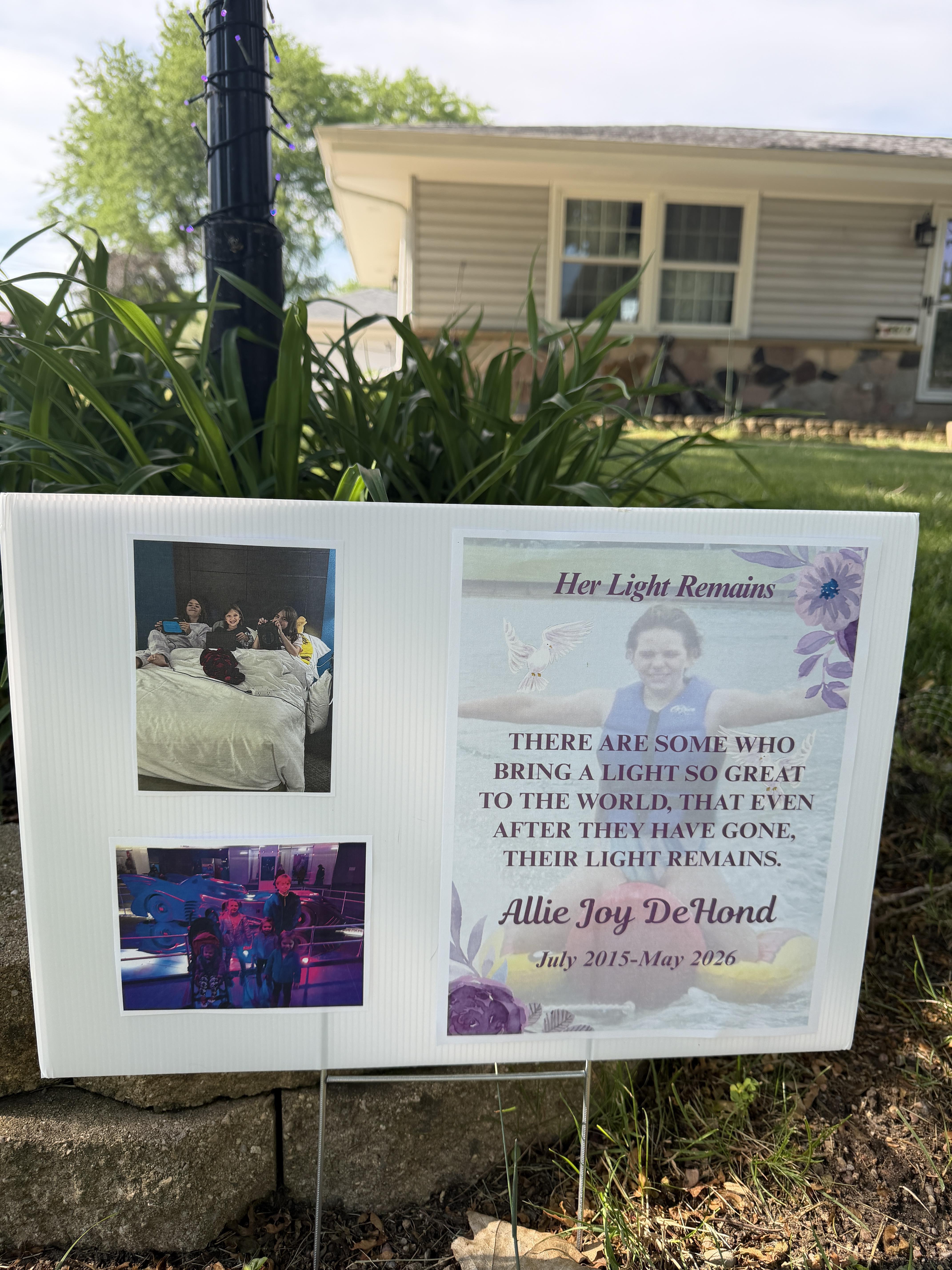 A sign in front of a house