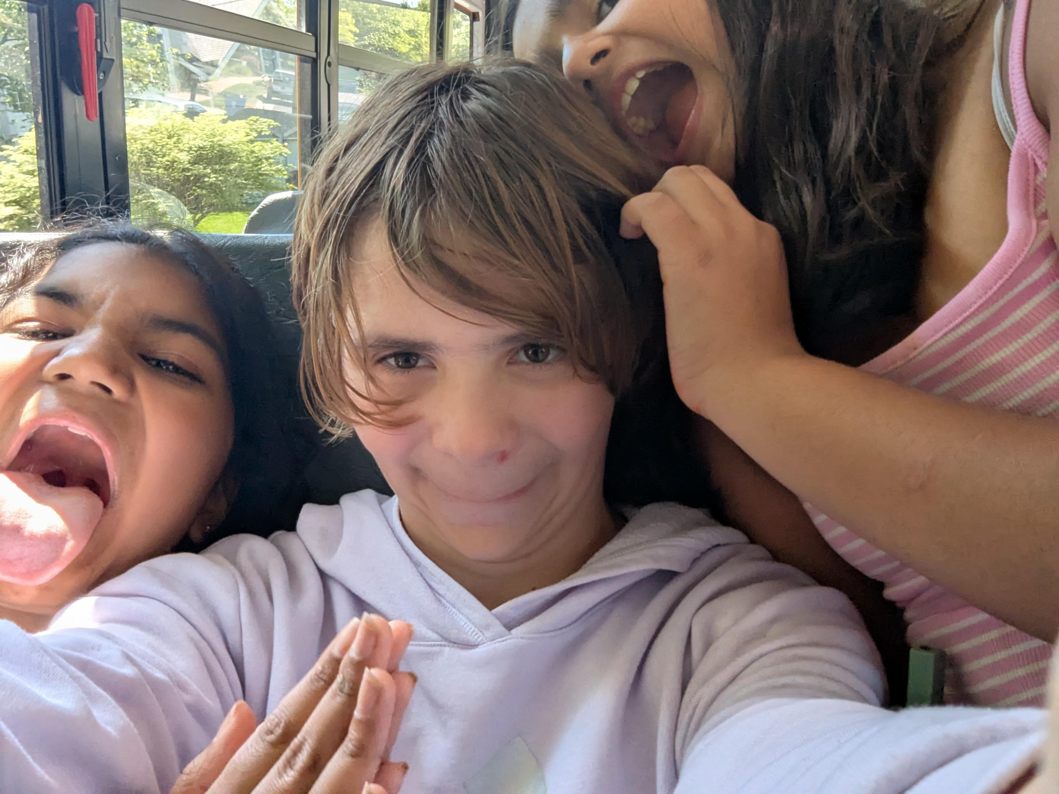 A group of people taking a selfie