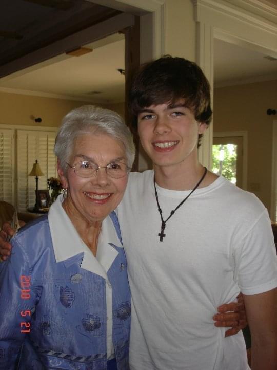 A woman and boy posing for a picture