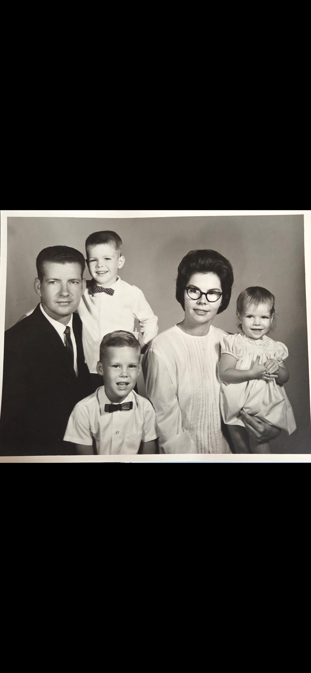 A family photo of a man and woman and children