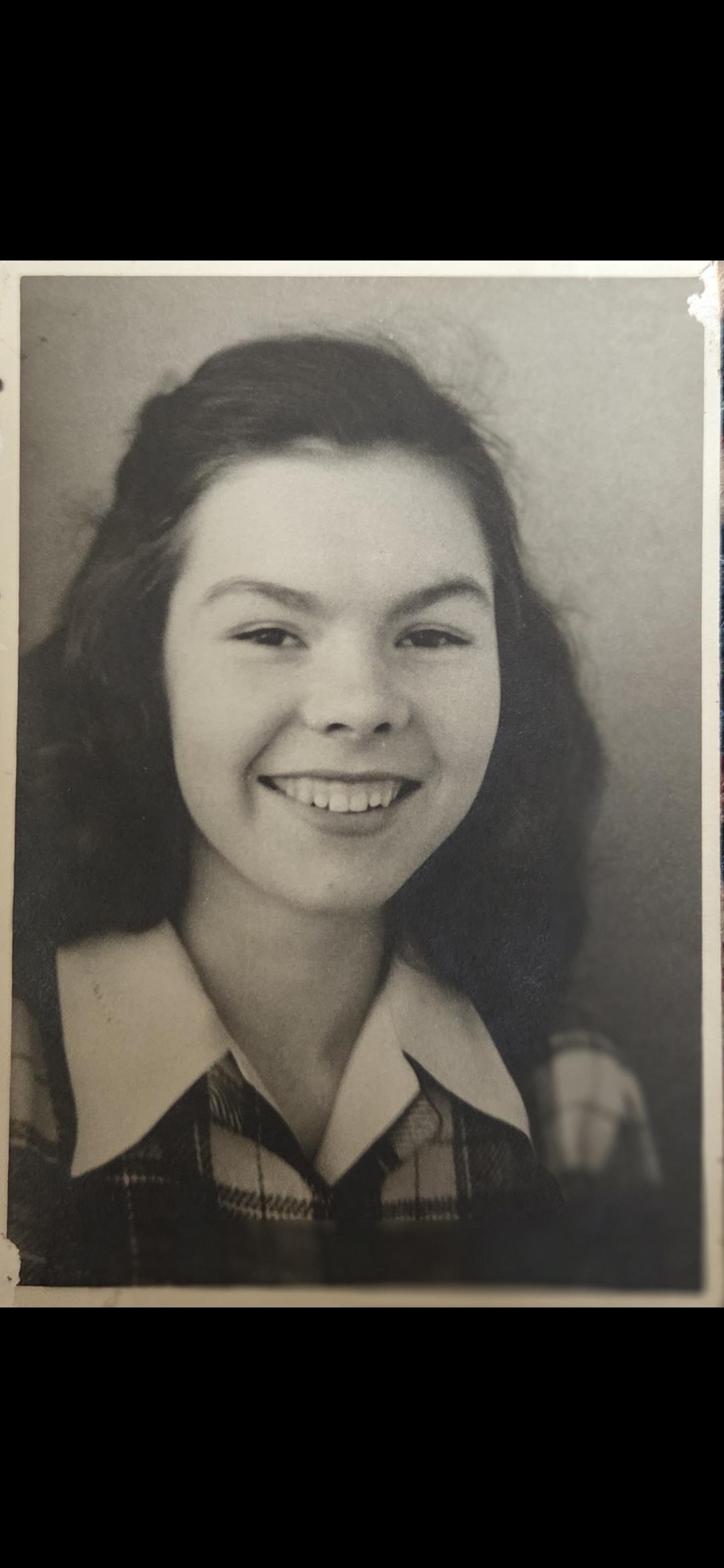 A close-up of a woman smiling