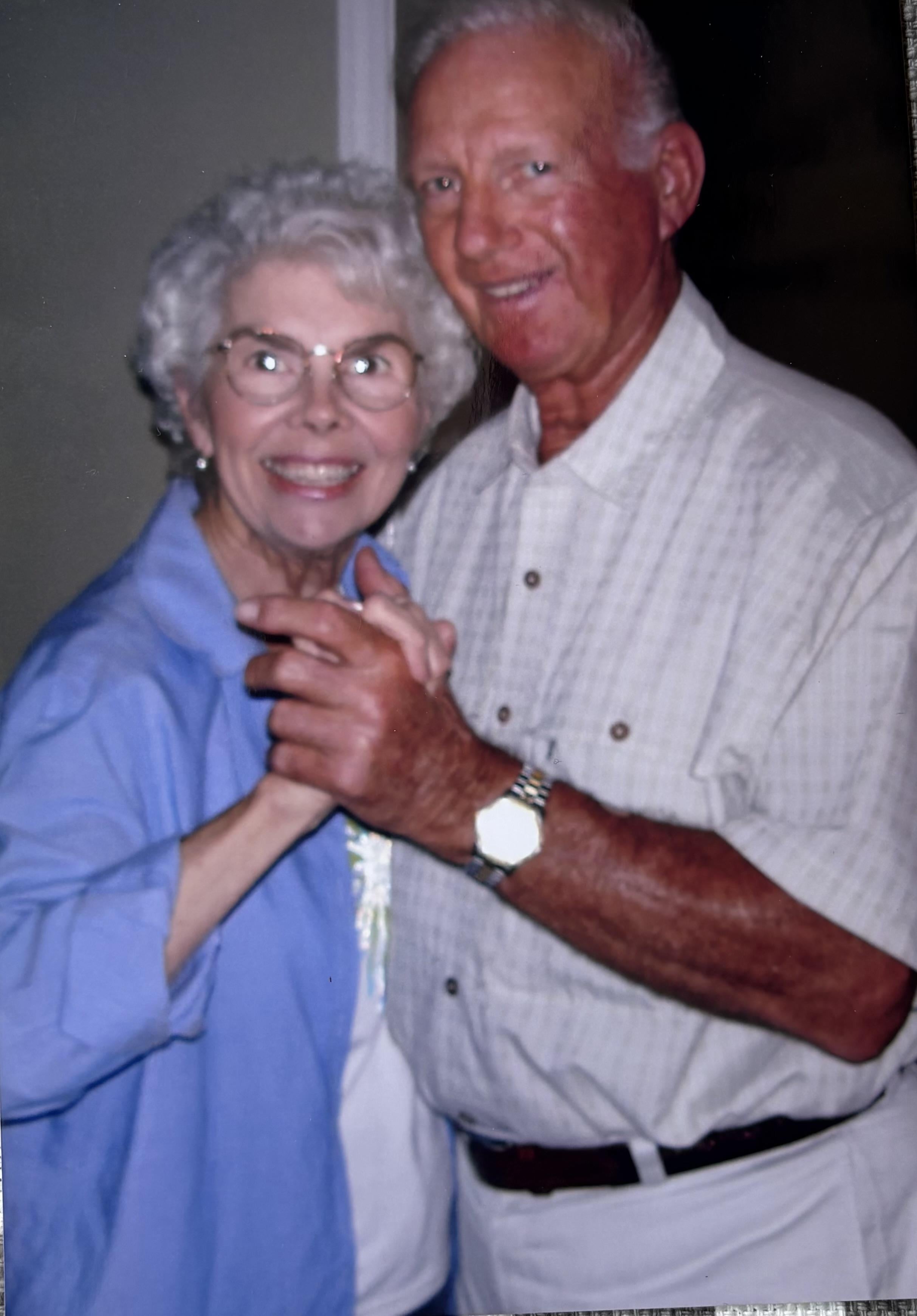 A man and woman holding hands