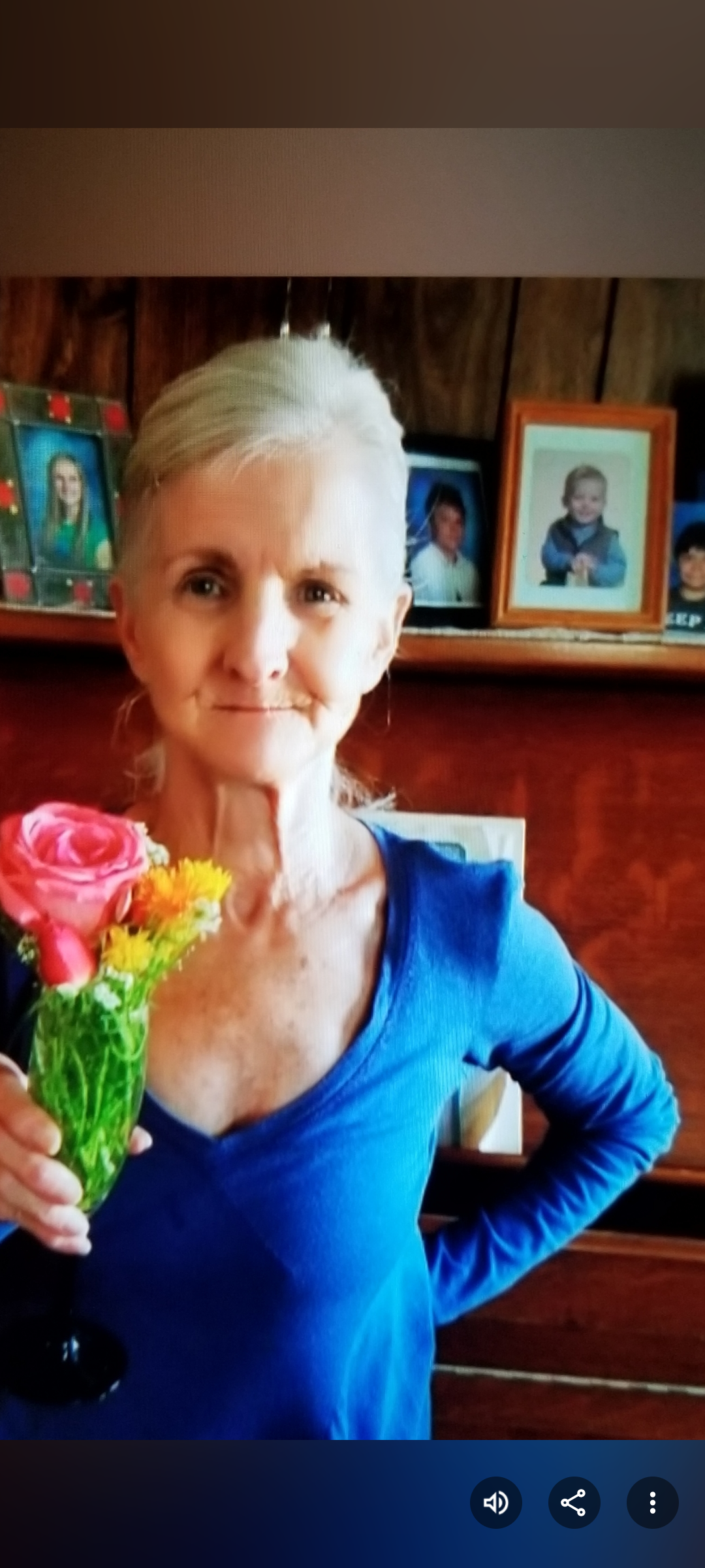 A woman holding a bouquet of flowers