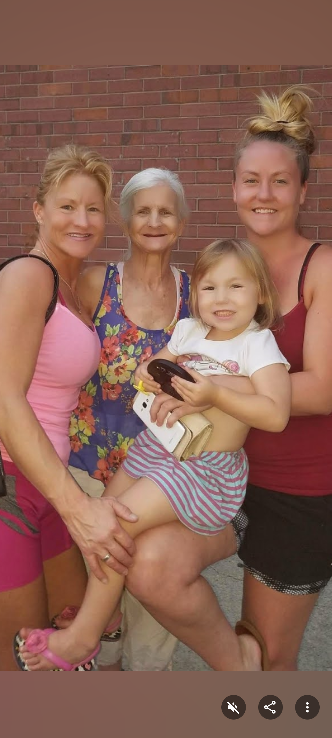 A group of women and a child posing for a photo