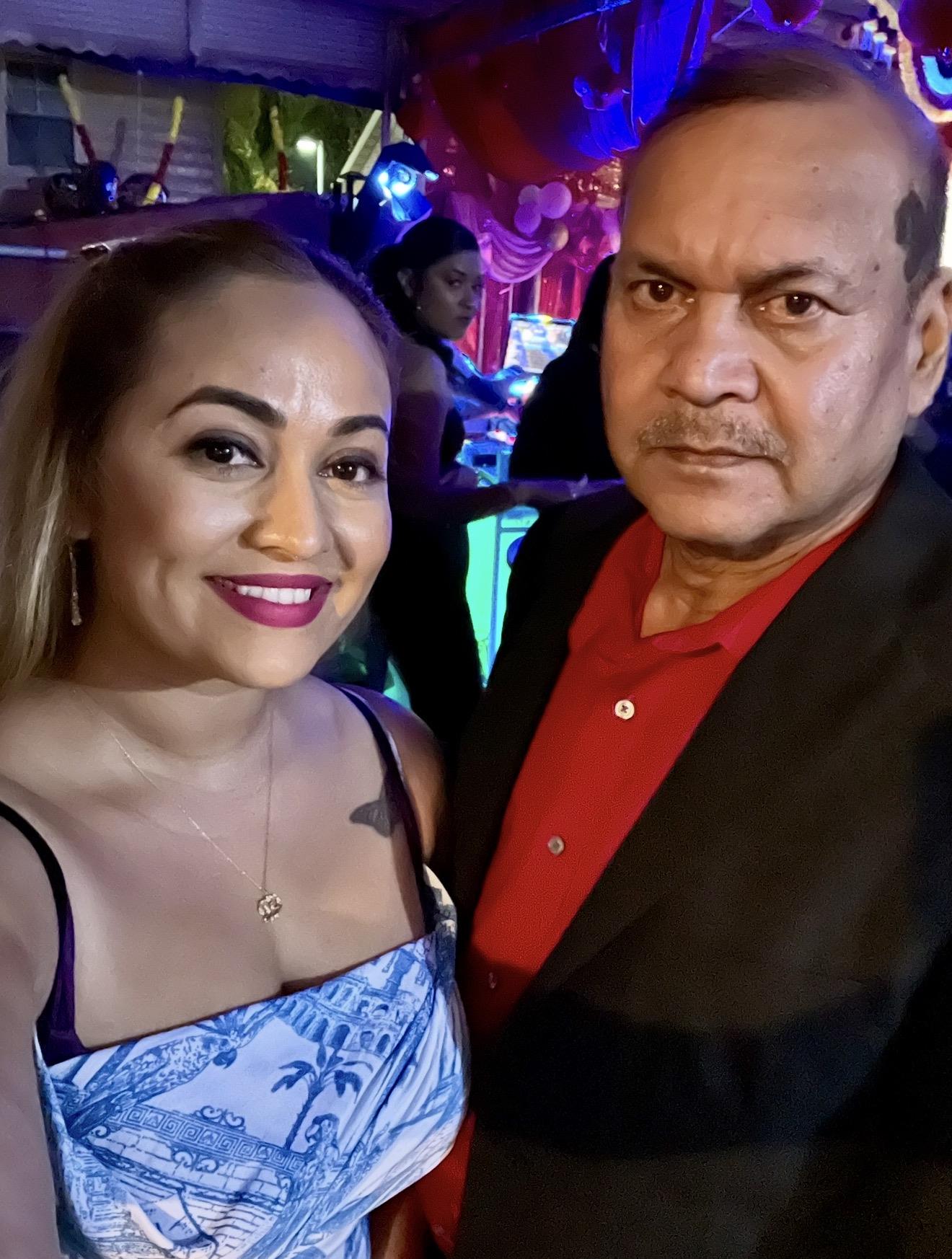 A man and woman posing for a selfie