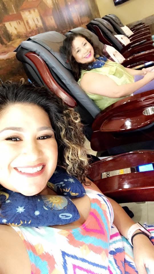 A group of women sitting in chairs