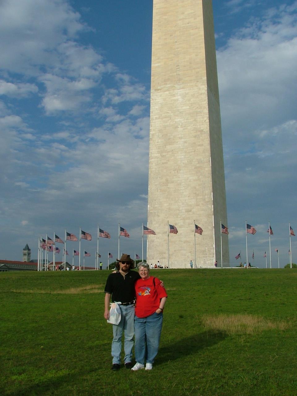 A couple standing in front of a monument