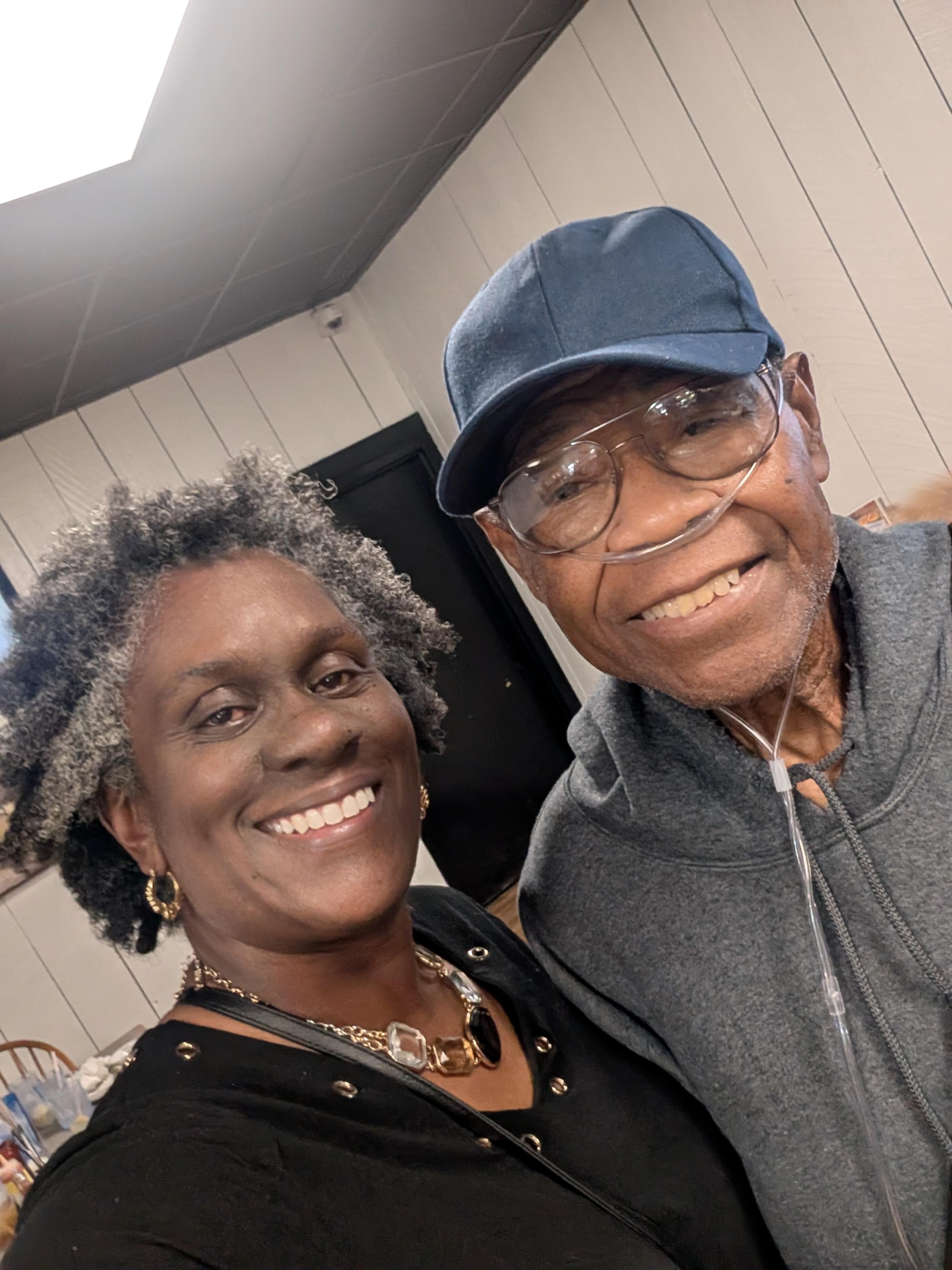 A man and woman smiling for a selfie